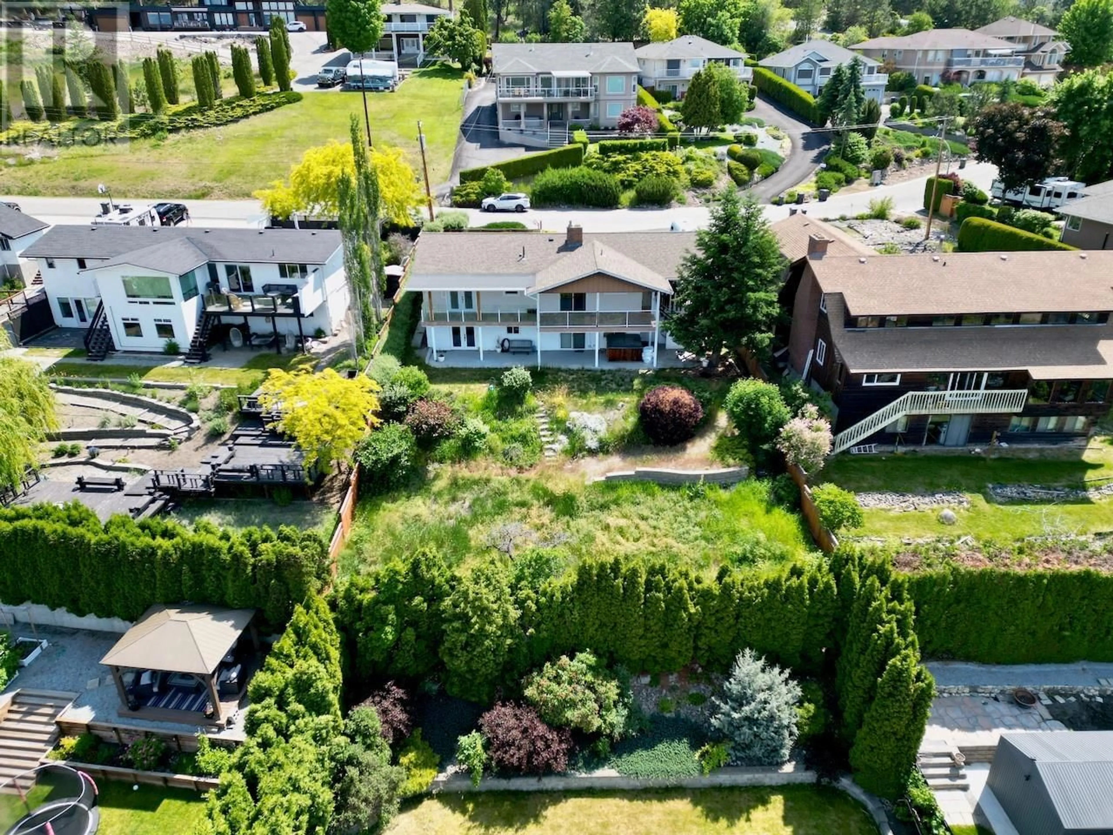 A pic from outside/outdoor area/front of a property/back of a property/a pic from drone, street for 1270 TOOVEY ROAD, Kelowna British Columbia V1X6R4
