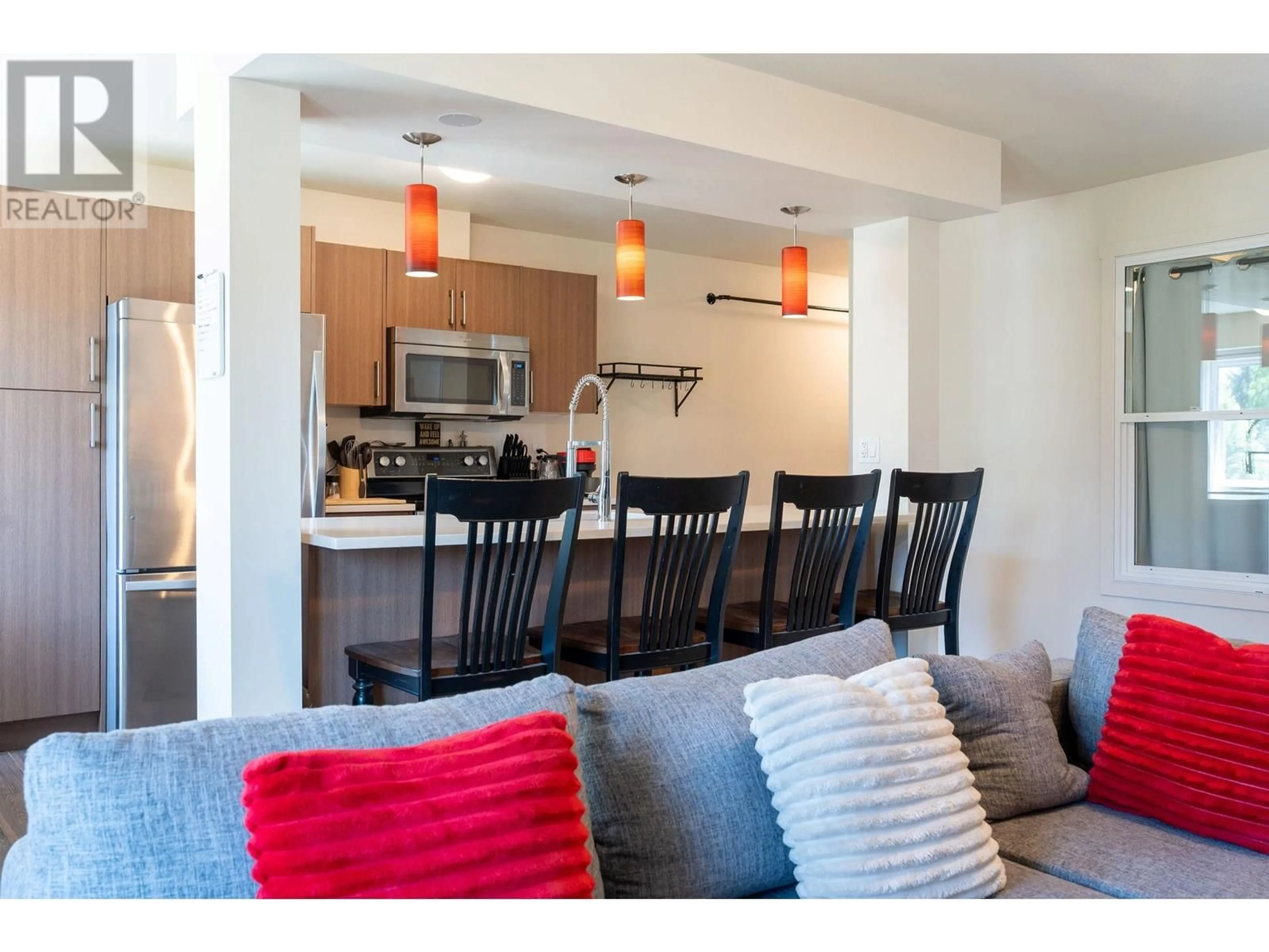 Open concept kitchen, wood/laminate floor for 304 - 1211 VICTORIA ROAD, Revelstoke British Columbia V0E2S0