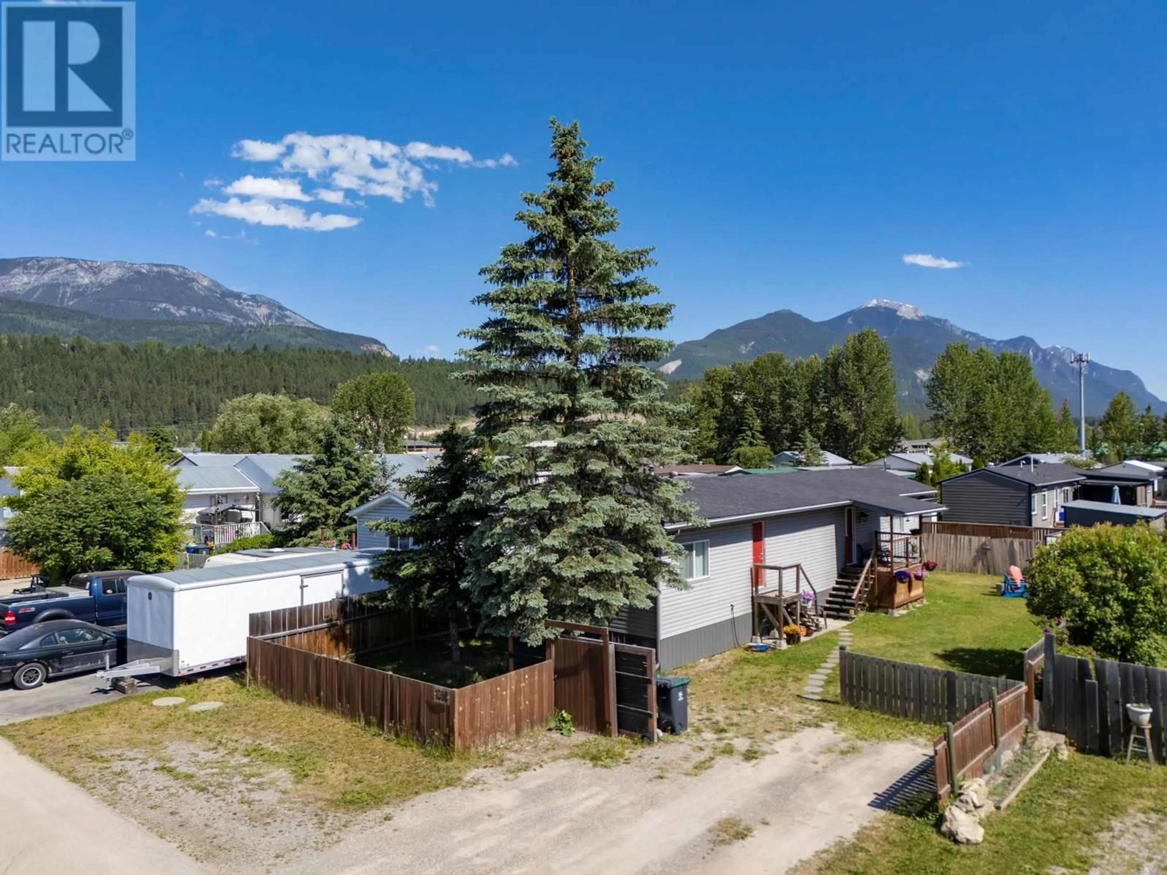 A pic from outside/outdoor area/front of a property/back of a property/a pic from drone, mountain view for 1056 KING CRESCENT, Golden British Columbia V0A1H0