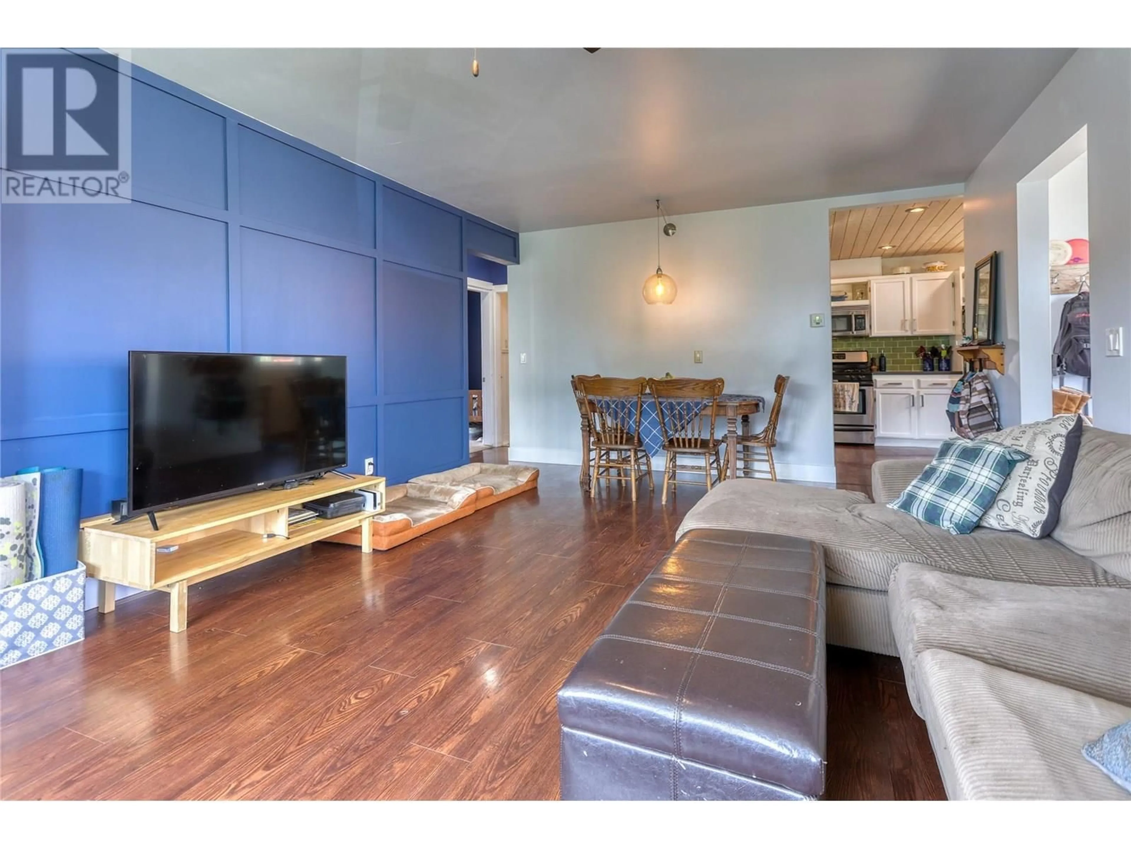 Living room with furniture, wood/laminate floor for 775 DICKENS STREET, Warfield British Columbia V1R2B7