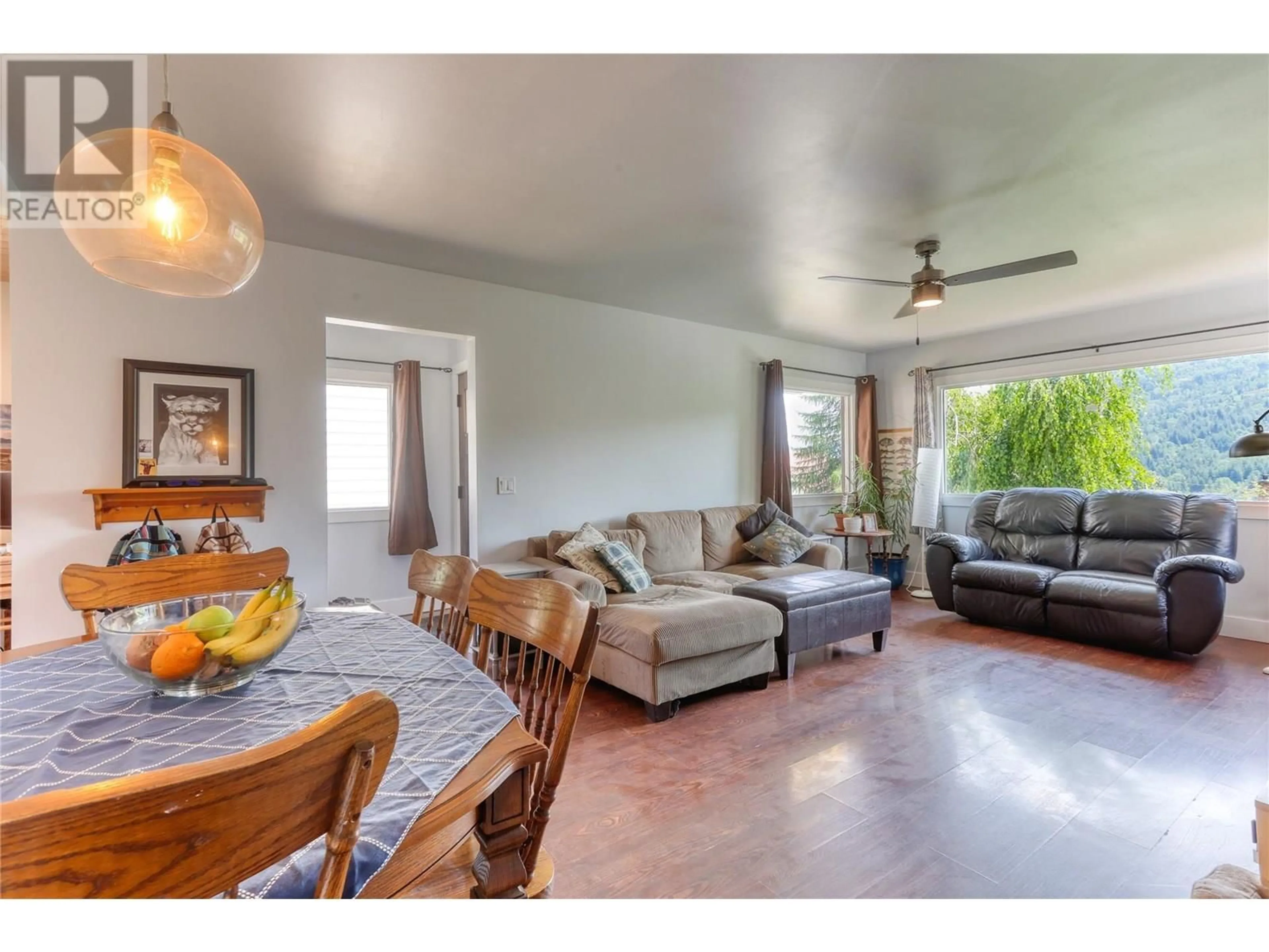 Living room with furniture, wood/laminate floor for 775 DICKENS STREET, Warfield British Columbia V1R2B7