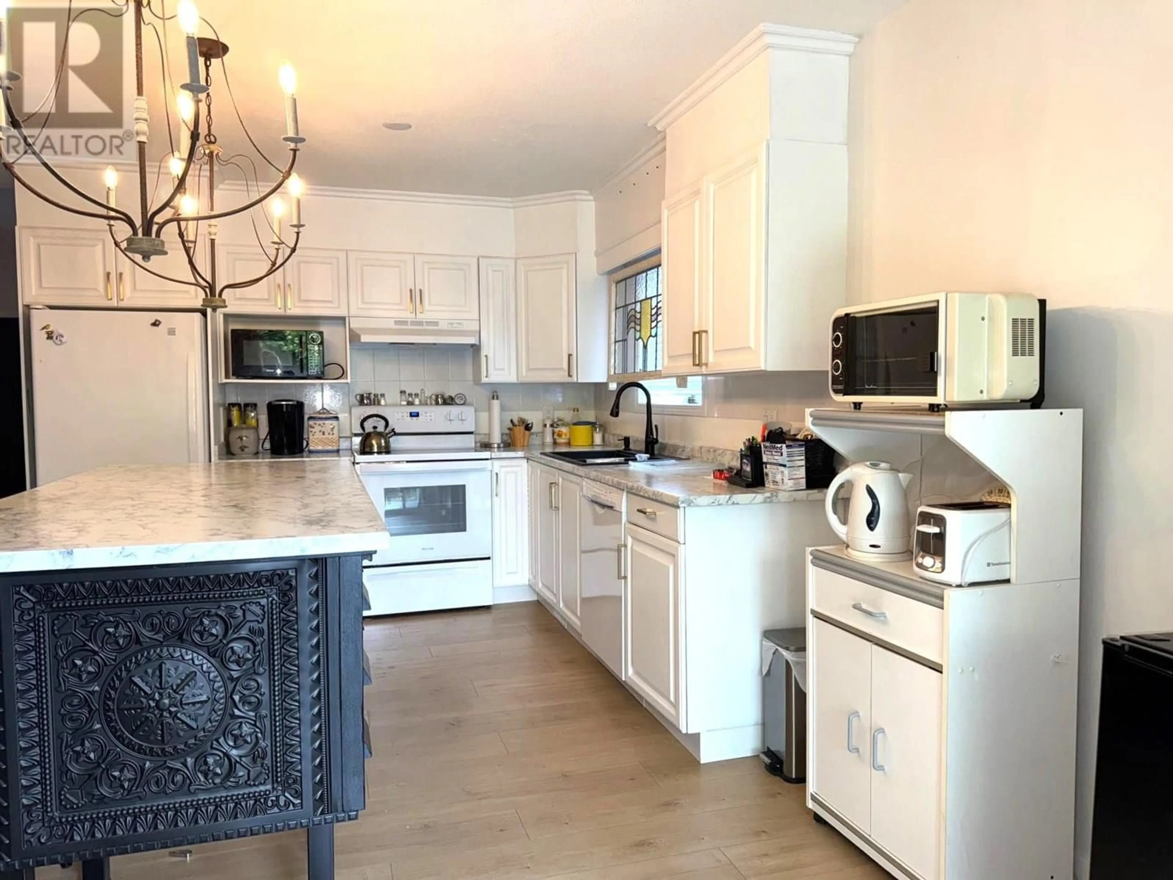 Open concept kitchen, wood/laminate floor for 17 - 2250 LOUIE DRIVE, Westbank British Columbia V4T2M6