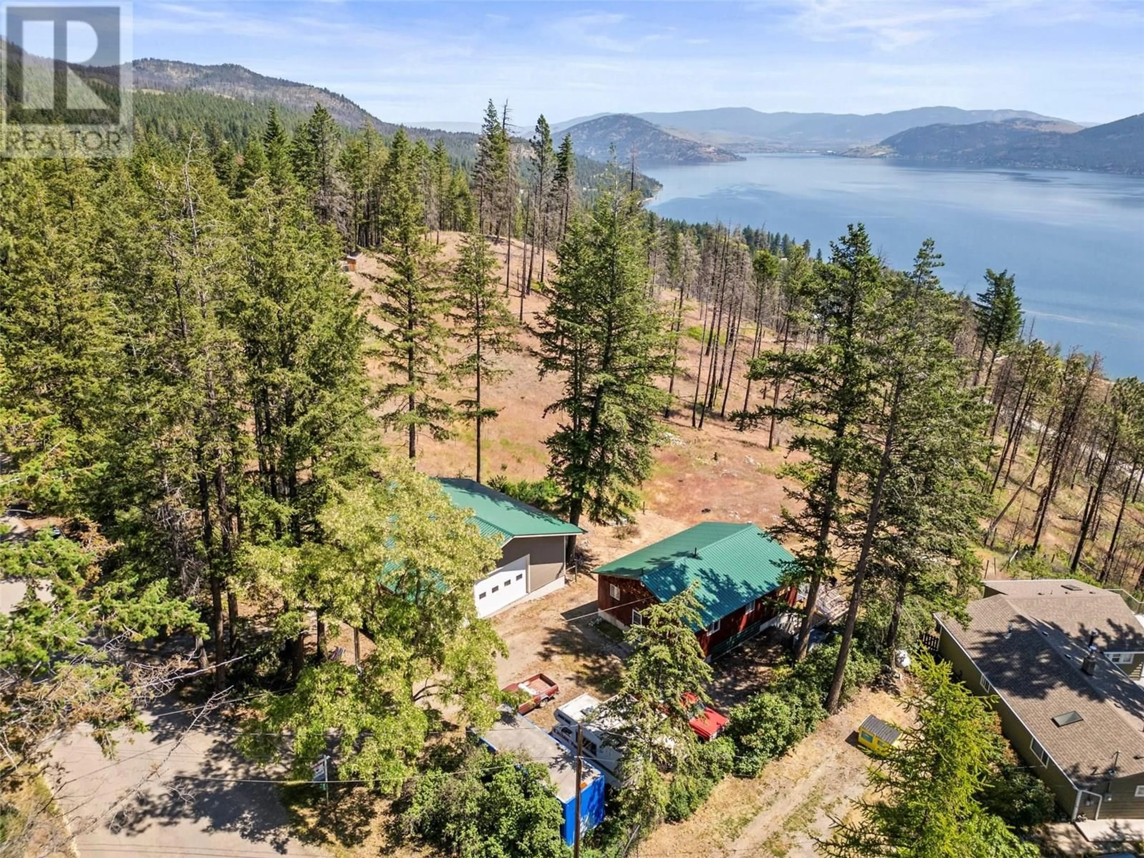 A pic from outside/outdoor area/front of a property/back of a property/a pic from drone, water/lake/river/ocean view for 725 UDELL ROAD, Vernon British Columbia V1H2E3