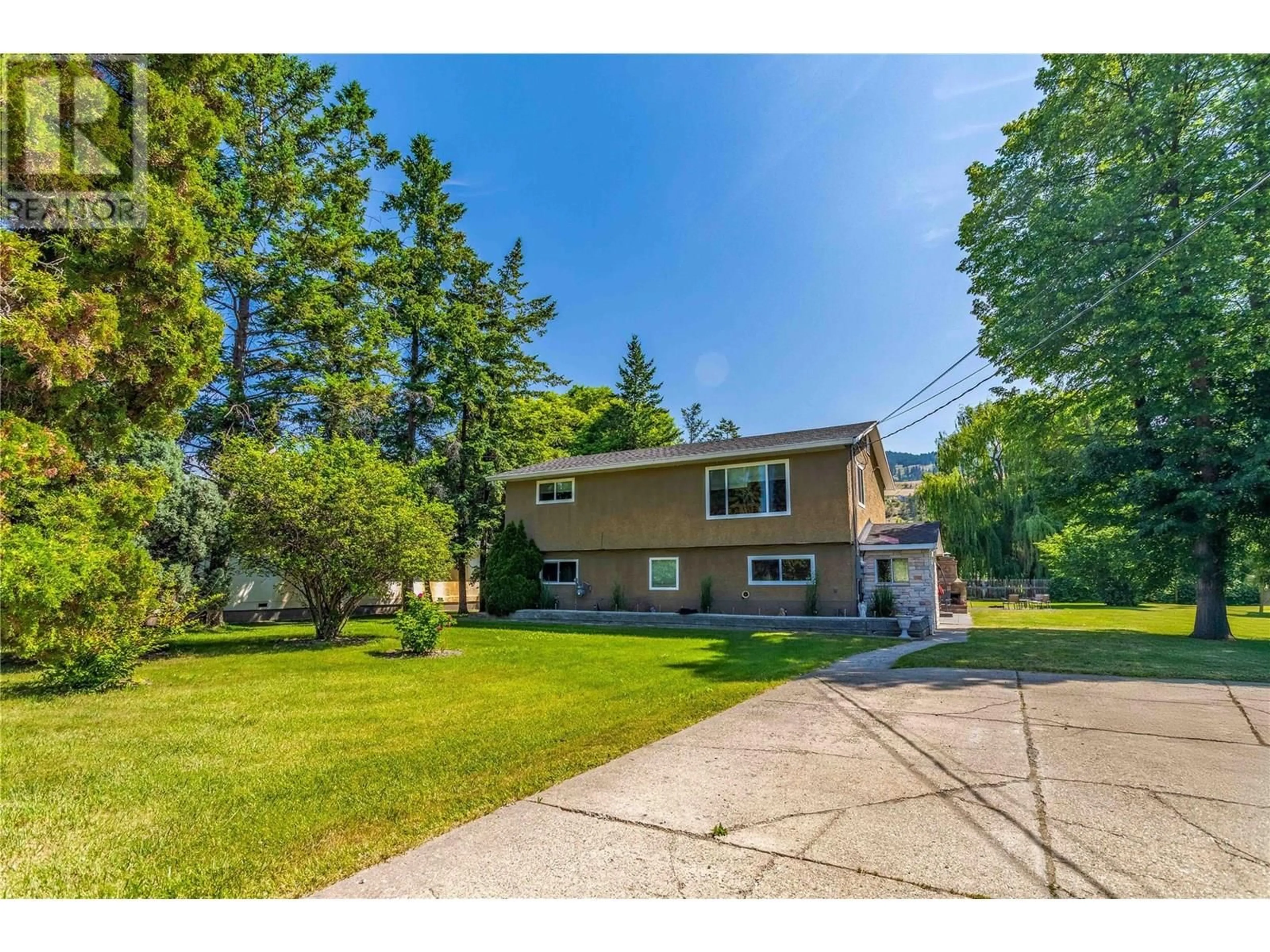 A pic from outside/outdoor area/front of a property/back of a property/a pic from drone, street for 11441 REISWIG ROAD, Lake Country British Columbia V4V1Y5