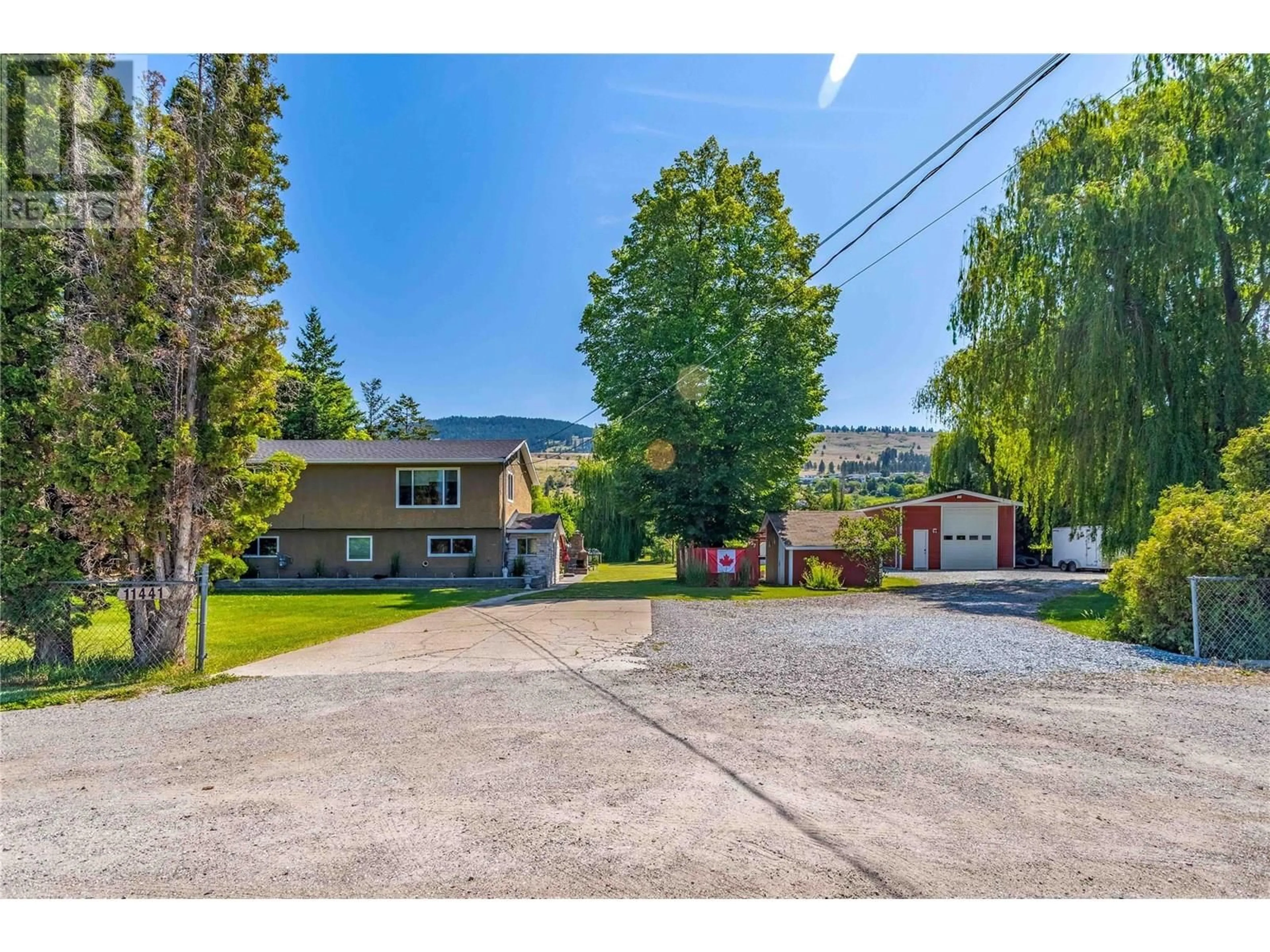 A pic from outside/outdoor area/front of a property/back of a property/a pic from drone, street for 11441 REISWIG ROAD, Lake Country British Columbia V4V1Y5