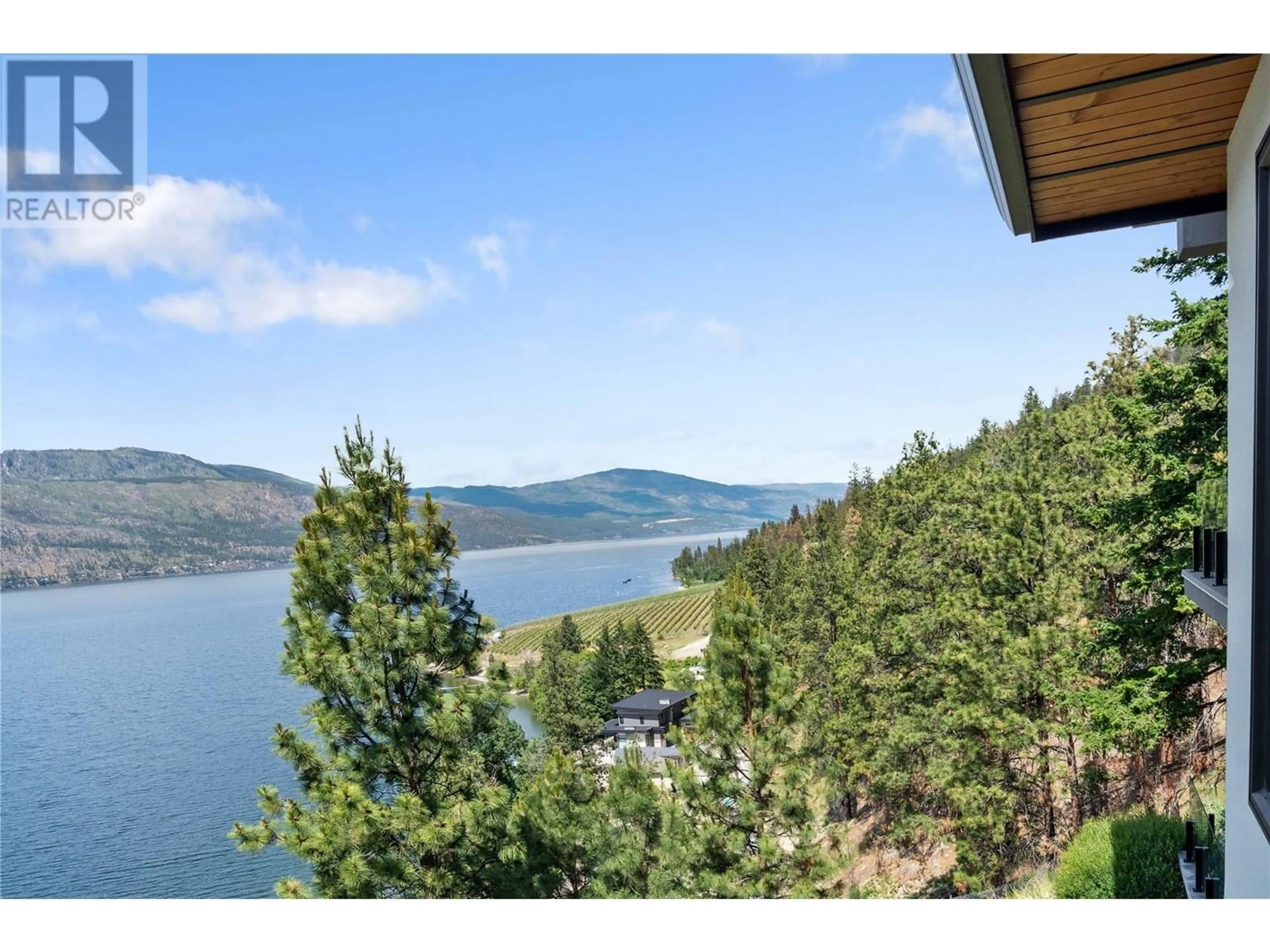 A pic from outside/outdoor area/front of a property/back of a property/a pic from drone, water/lake/river/ocean view for 1526 MARBLE LEDGE DRIVE, Lake Country British Columbia V4V2T4