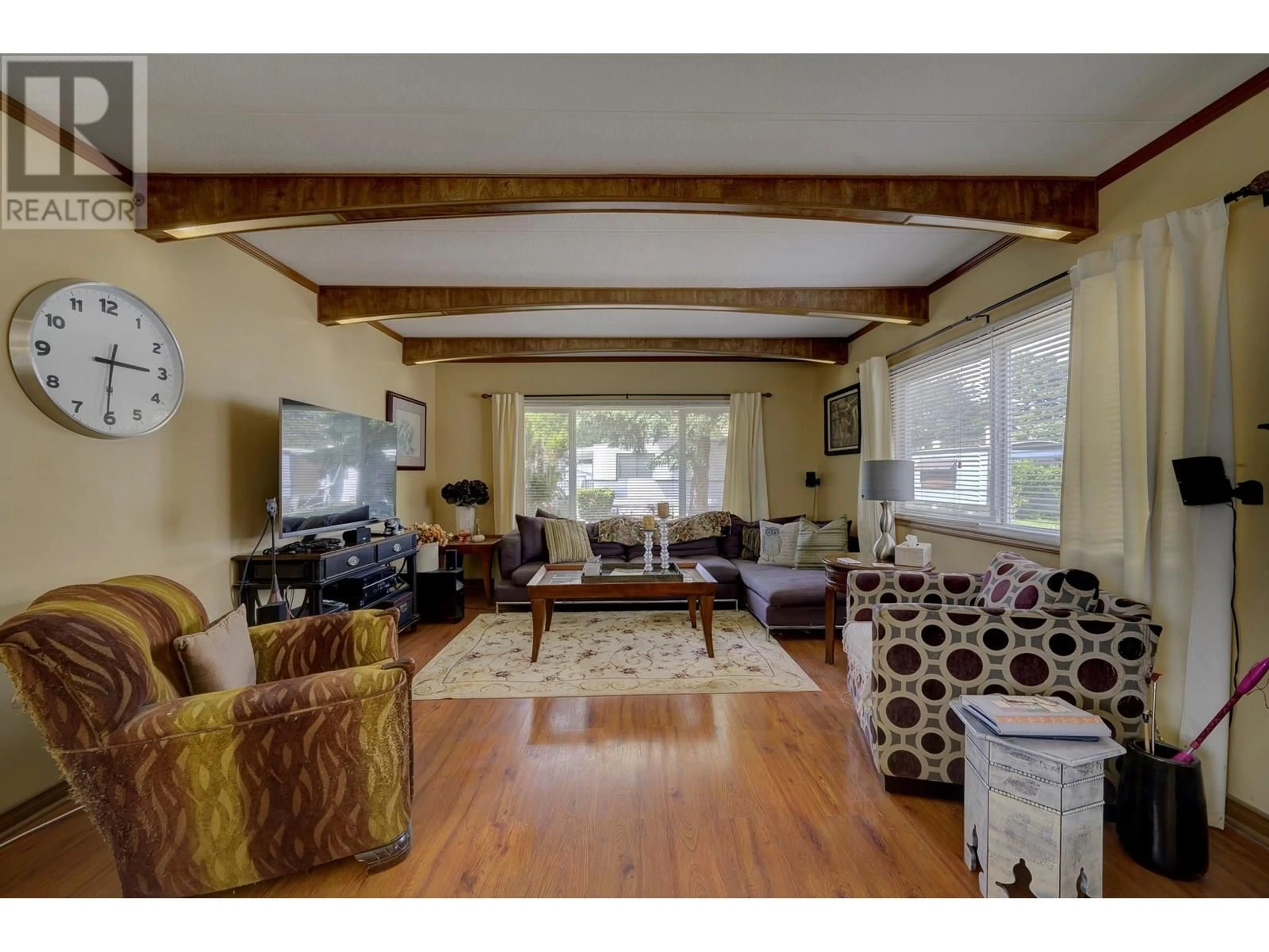 Living room with furniture, wood/laminate floor for 216 - 2400 OAKDALE WAY, Kamloops British Columbia V2B6W7