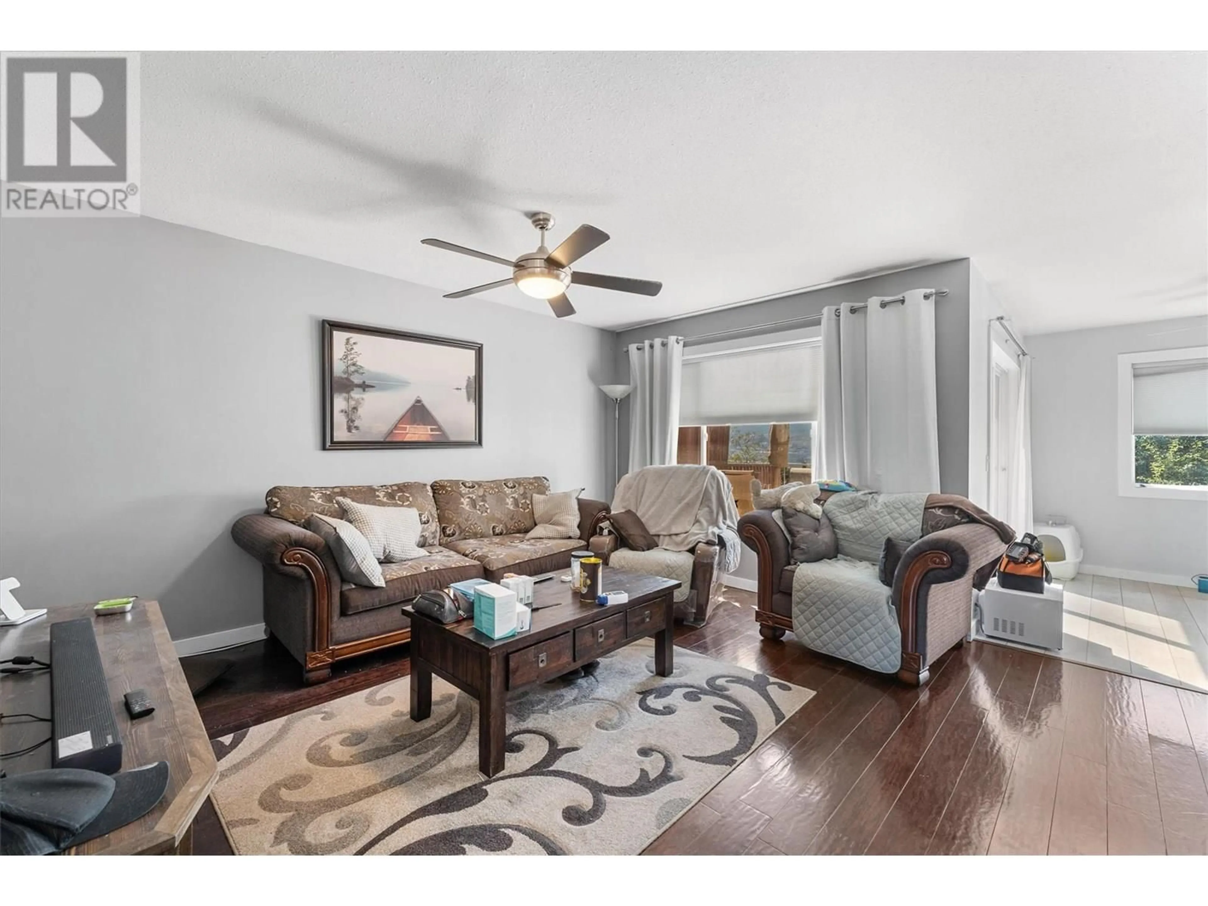 Living room with furniture, wood/laminate floor for 307 - 2440 OLD OKANAGAN HIGHWAY, West Kelowna British Columbia V4T1X6