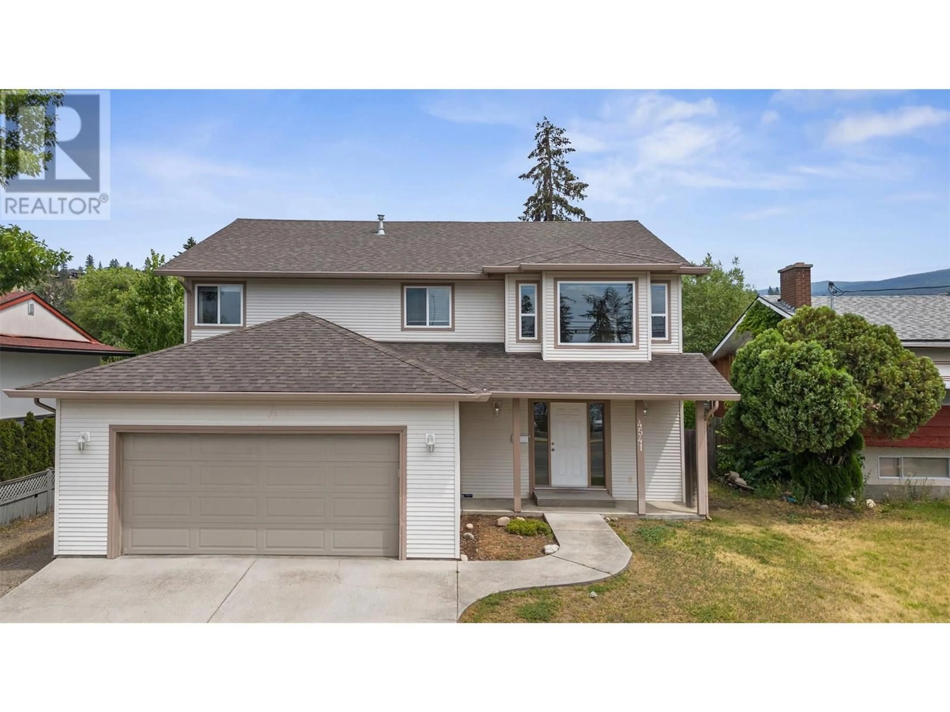 Home with vinyl exterior material, street for 4541 GORDON DRIVE, Kelowna British Columbia V1W1T3