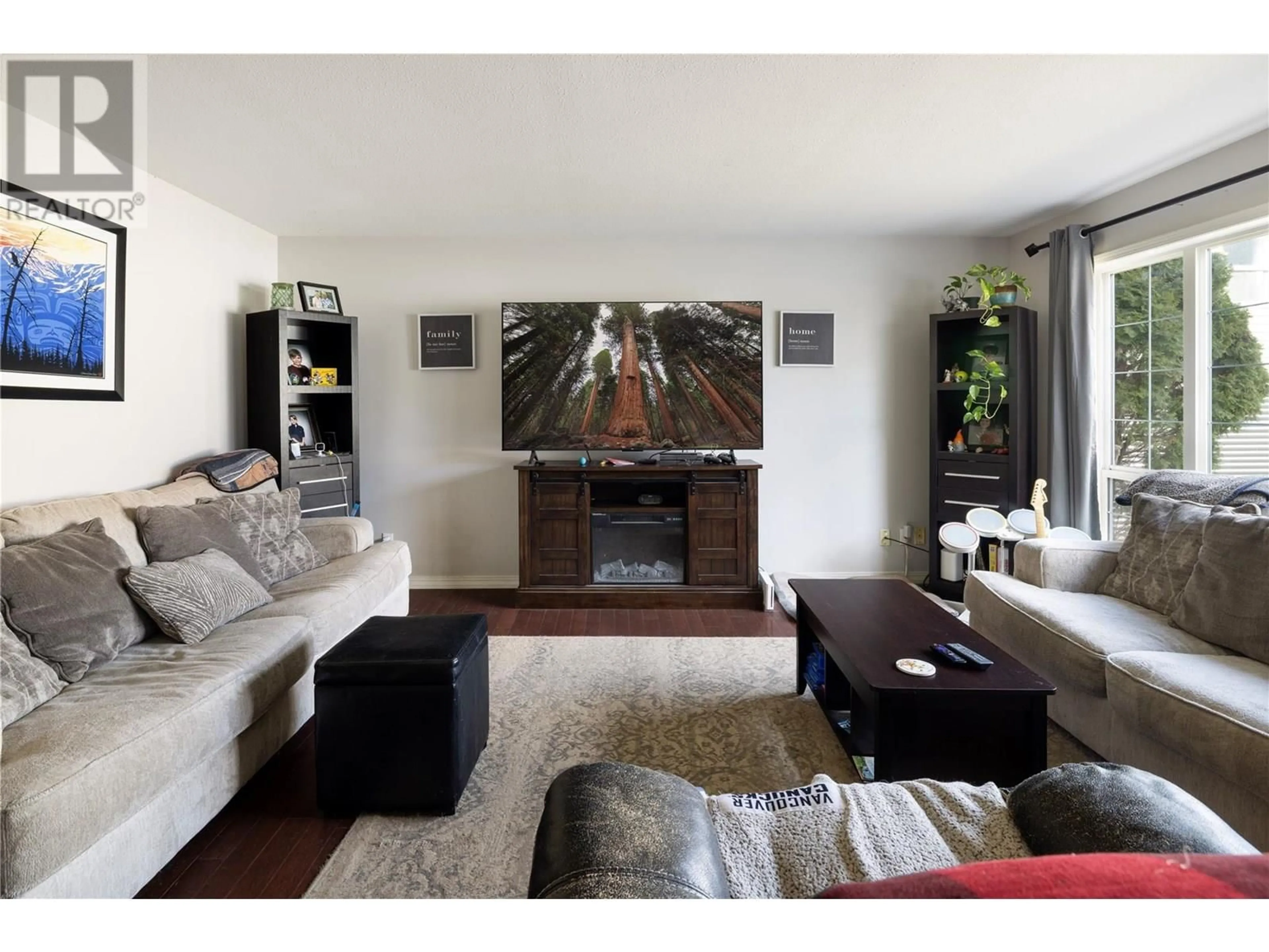 Living room with furniture, wood/laminate floor for 3767 GLOVER AVENUE EAST, Armstrong British Columbia V0E1B4