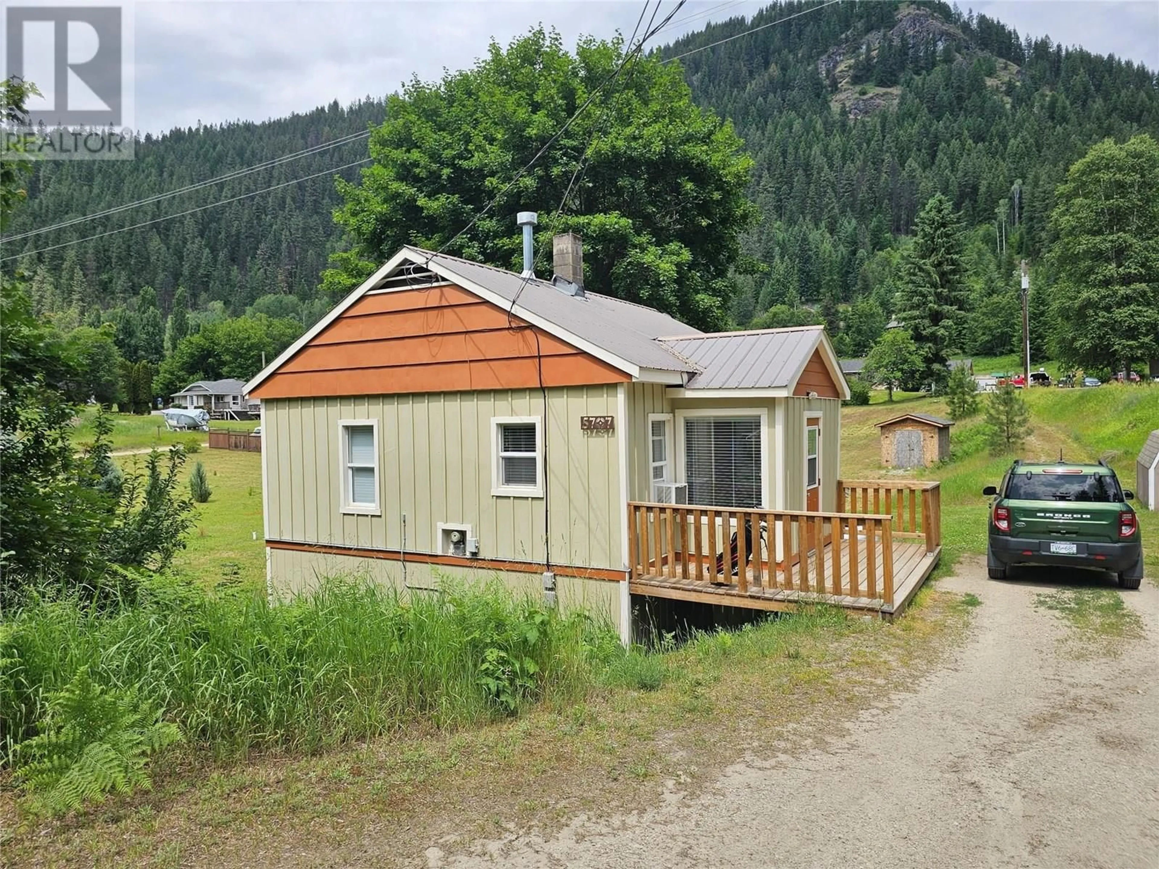 A pic from outside/outdoor area/front of a property/back of a property/a pic from drone, unknown for 5707 KHADIKIN ROAD, Taghum British Columbia V1L6Y2