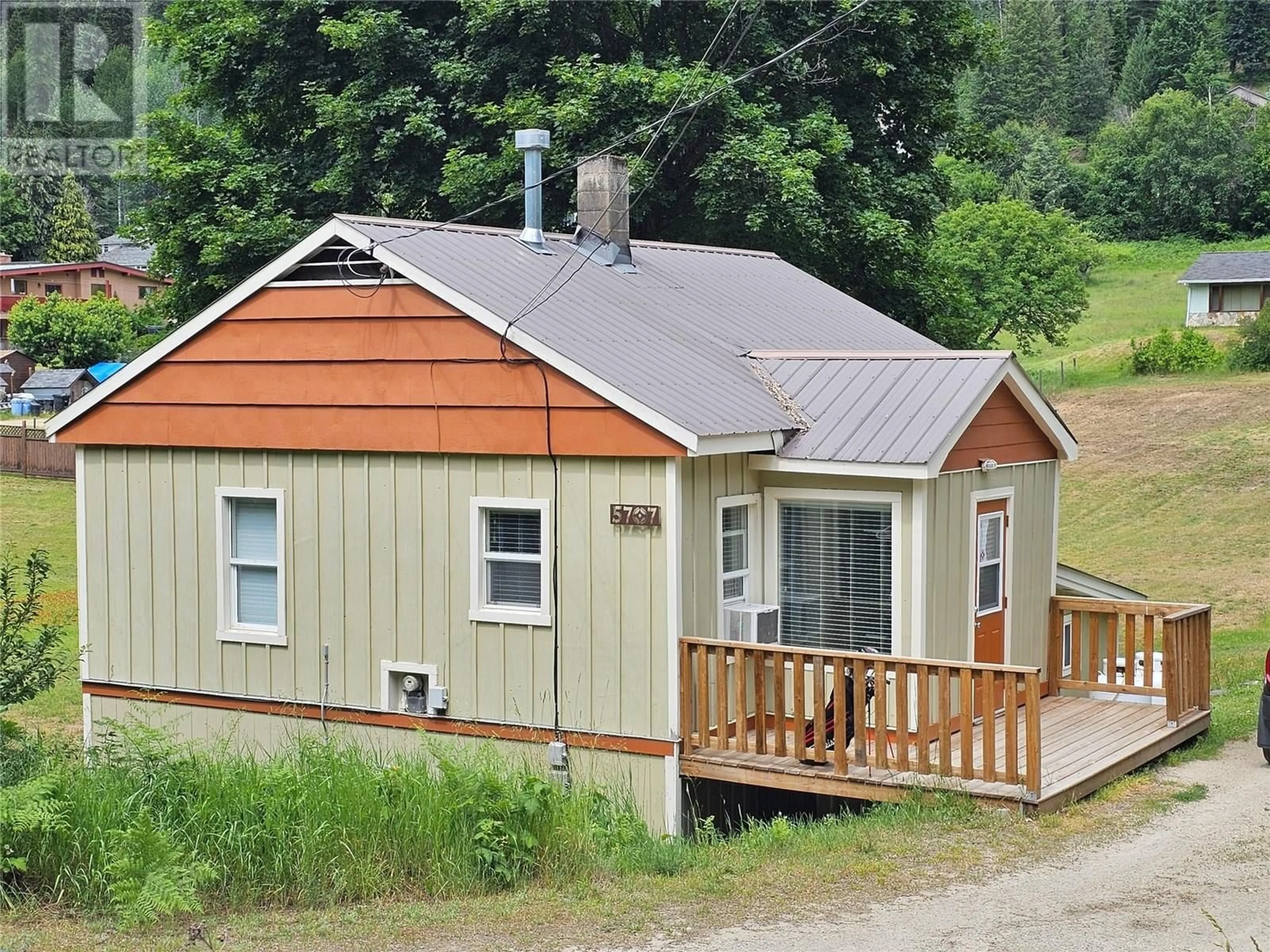 A pic from outside/outdoor area/front of a property/back of a property/a pic from drone, street for 5707 KHADIKIN ROAD, Taghum British Columbia V1L6Y2