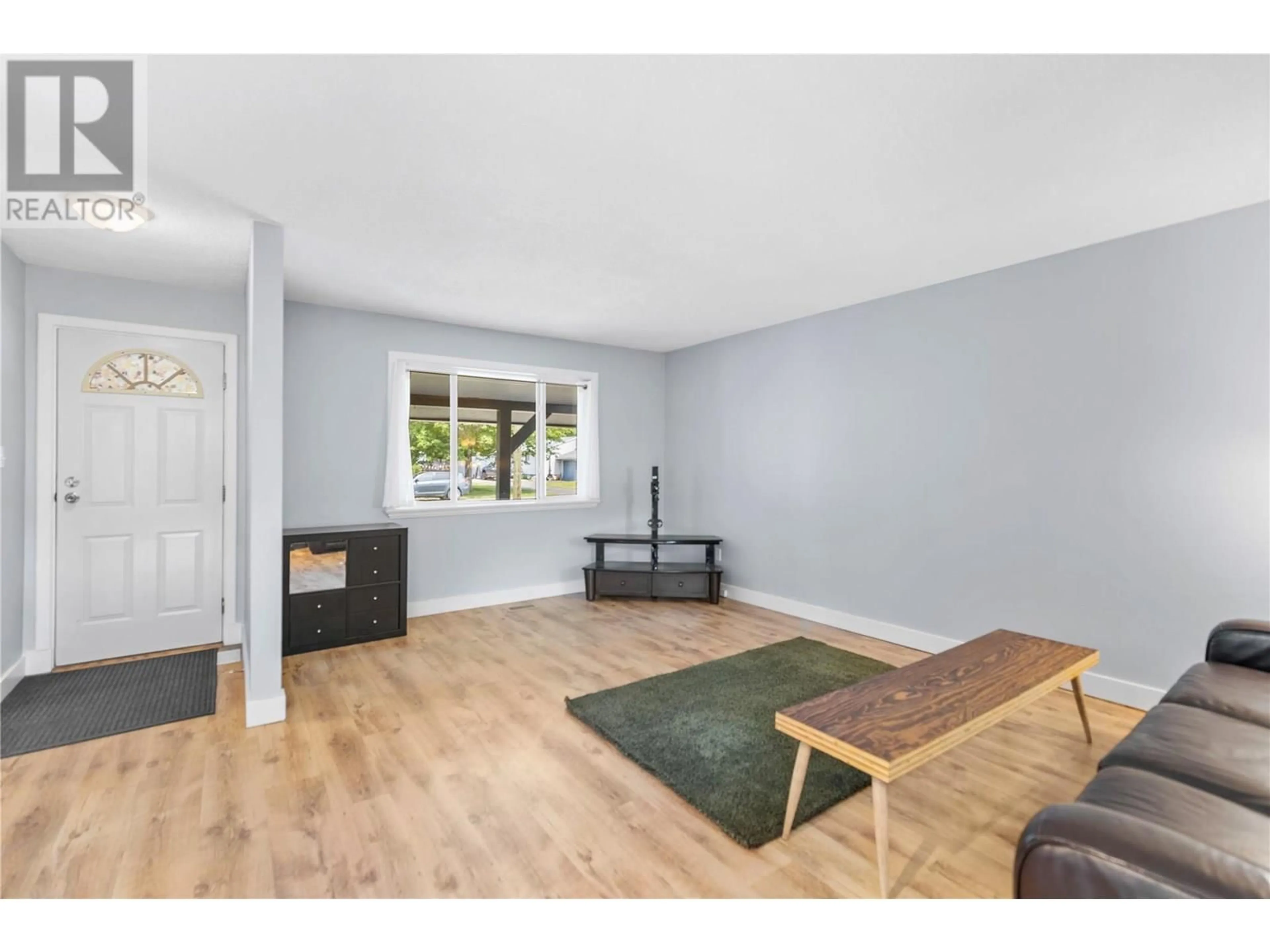 Living room with furniture, wood/laminate floor for 352 HELMCKEN STREET, Clearwater British Columbia V0E1N1