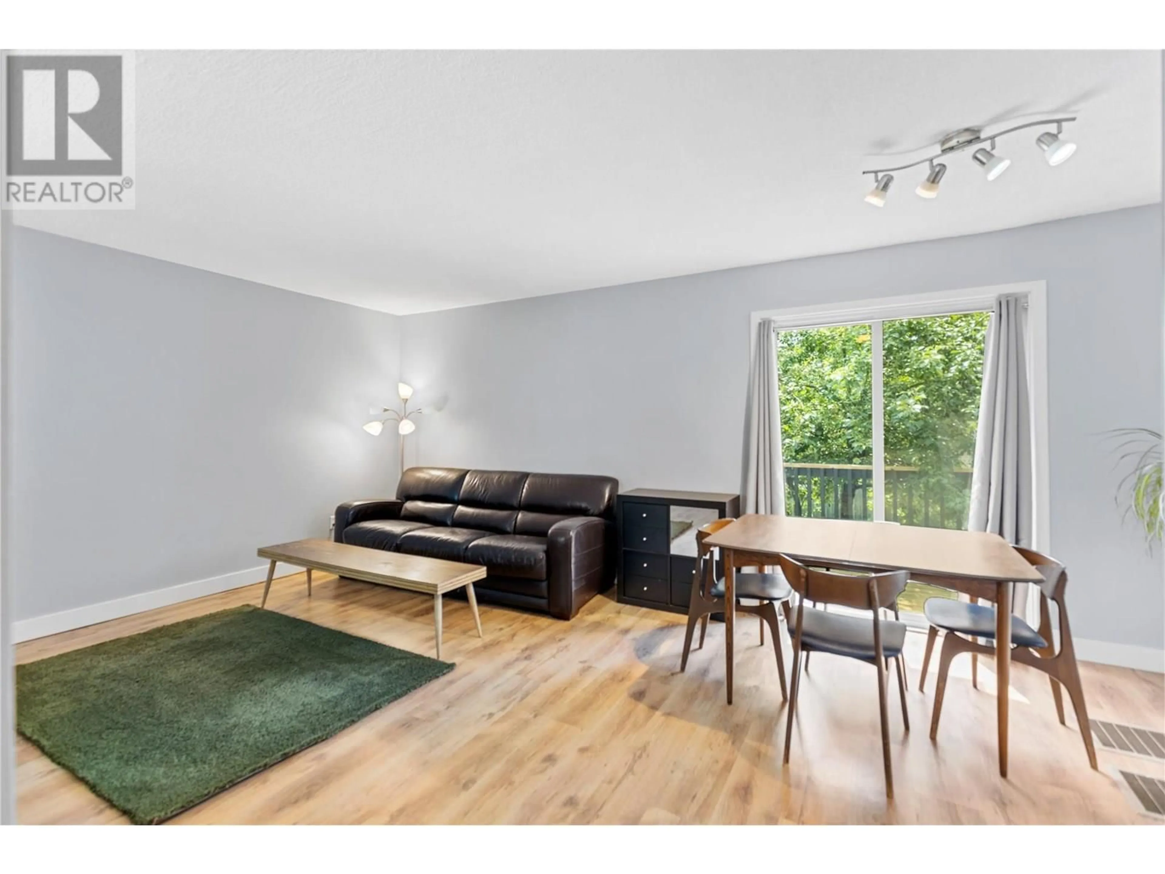 Living room with furniture, wood/laminate floor for 352 HELMCKEN STREET, Clearwater British Columbia V0E1N1