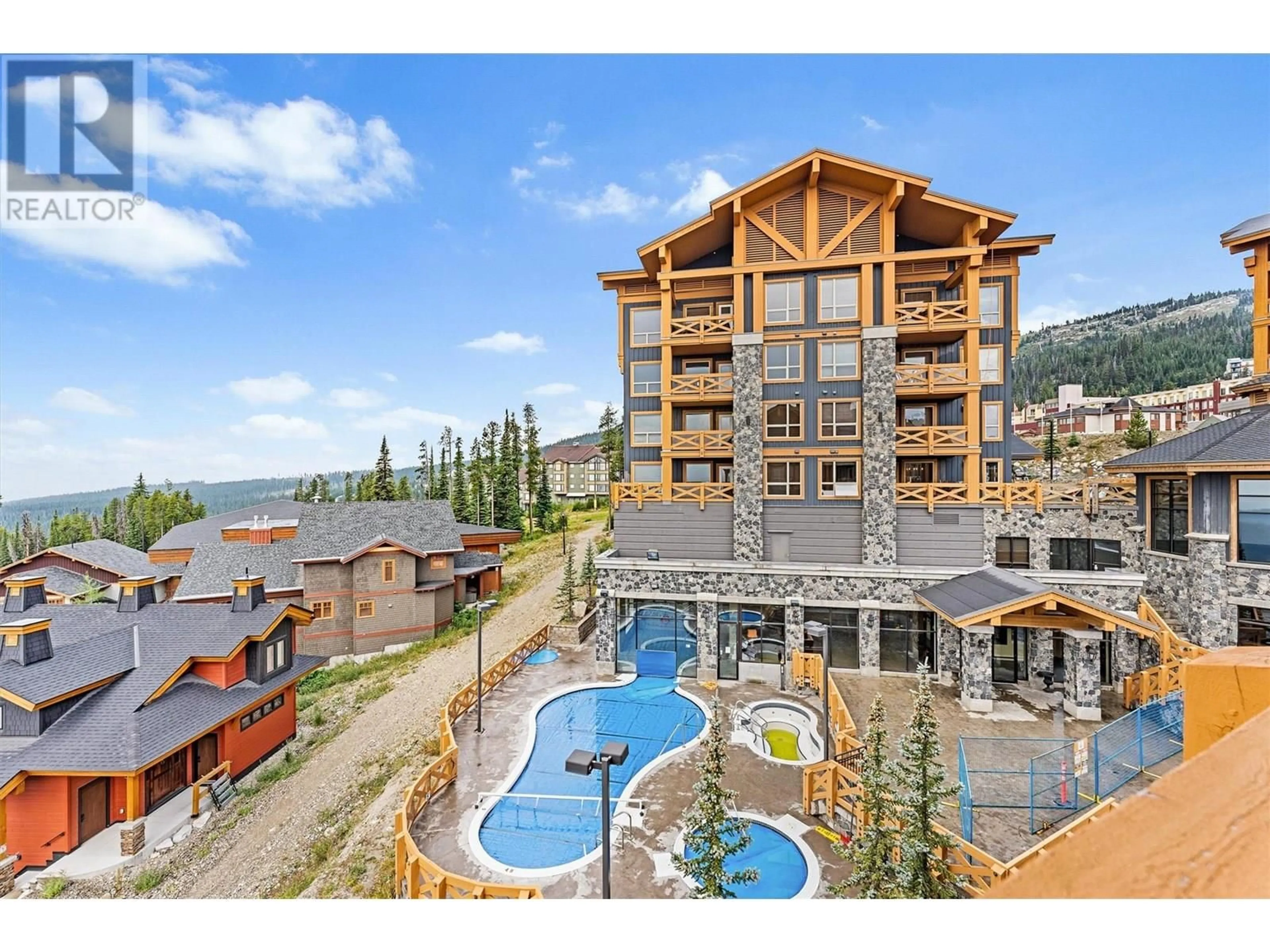 A pic from outside/outdoor area/front of a property/back of a property/a pic from drone, mountain view for 404 - 375 RAVEN RIDGE ROAD, Big White British Columbia V1P1P3
