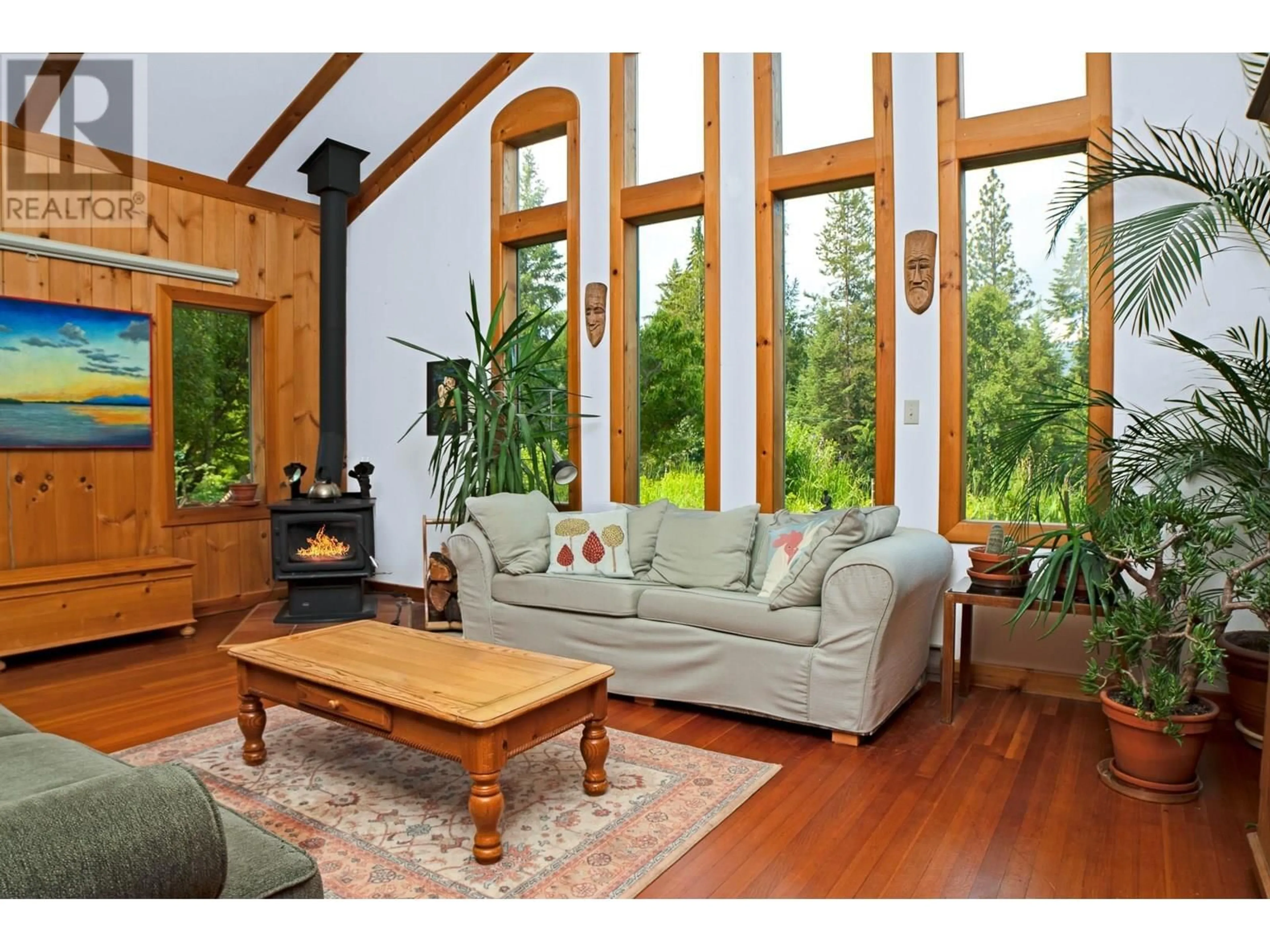 Living room with furniture, wood/laminate floor for 912 RIONDEL ROAD, Riondel British Columbia V0B2B0