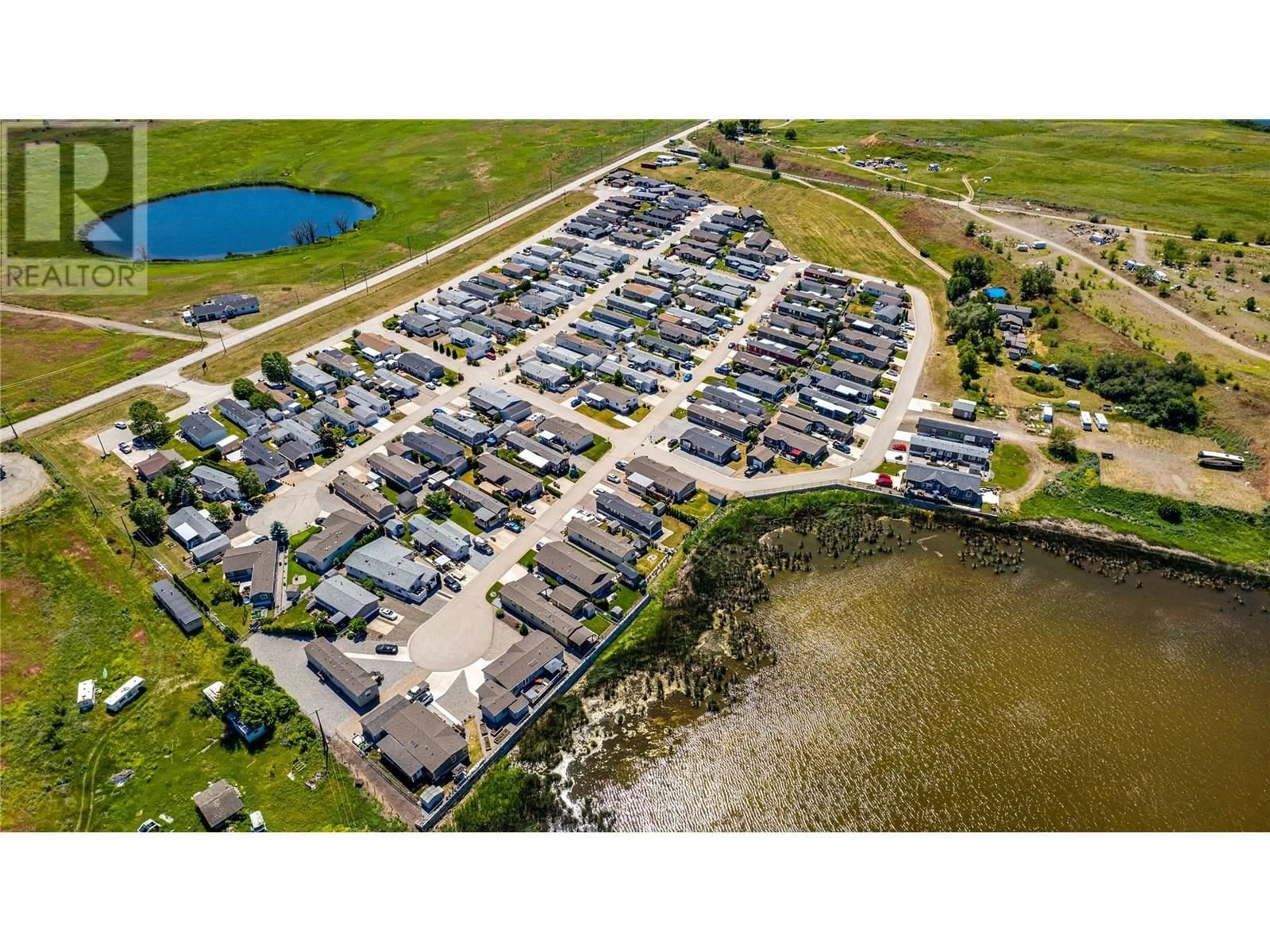 A pic from outside/outdoor area/front of a property/back of a property/a pic from drone, water/lake/river/ocean view for 81 - 12560 WESTSIDE ROAD, Vernon British Columbia V1H1S9