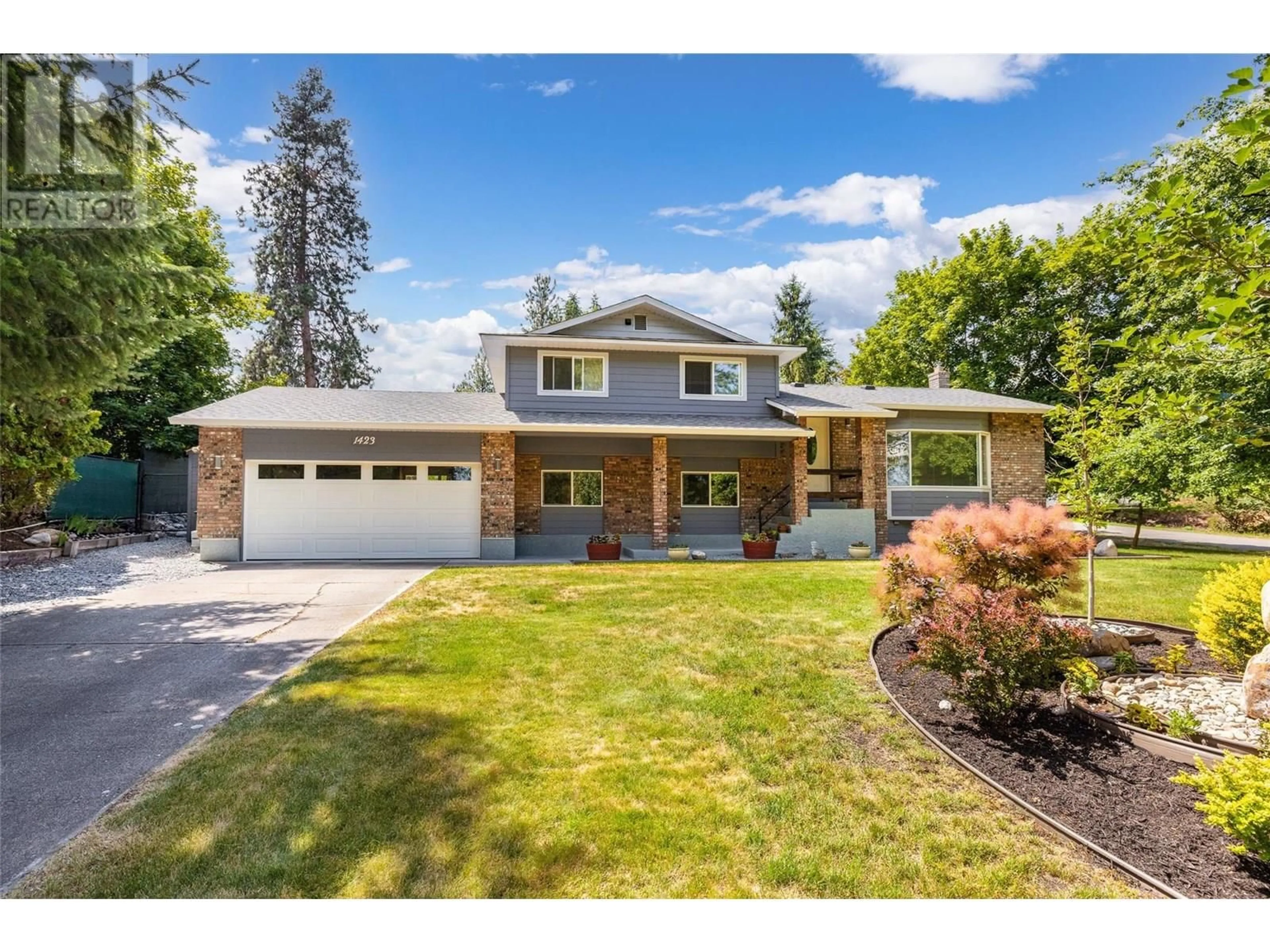 Home with brick exterior material, street for 1423 MISSION RIDGE DRIVE, Kelowna British Columbia V1W3B1