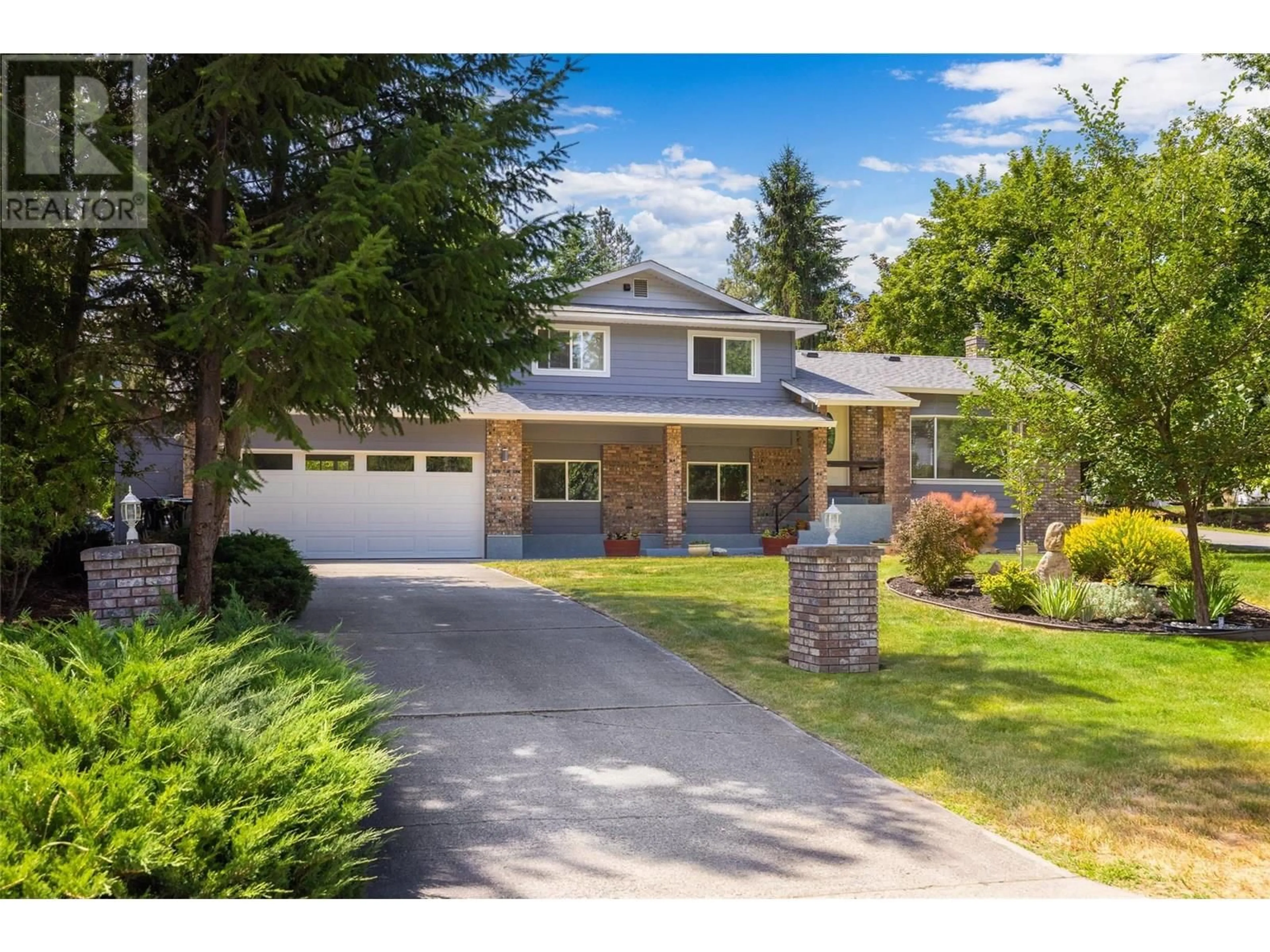 Home with brick exterior material, street for 1423 MISSION RIDGE DRIVE, Kelowna British Columbia V1W3B1