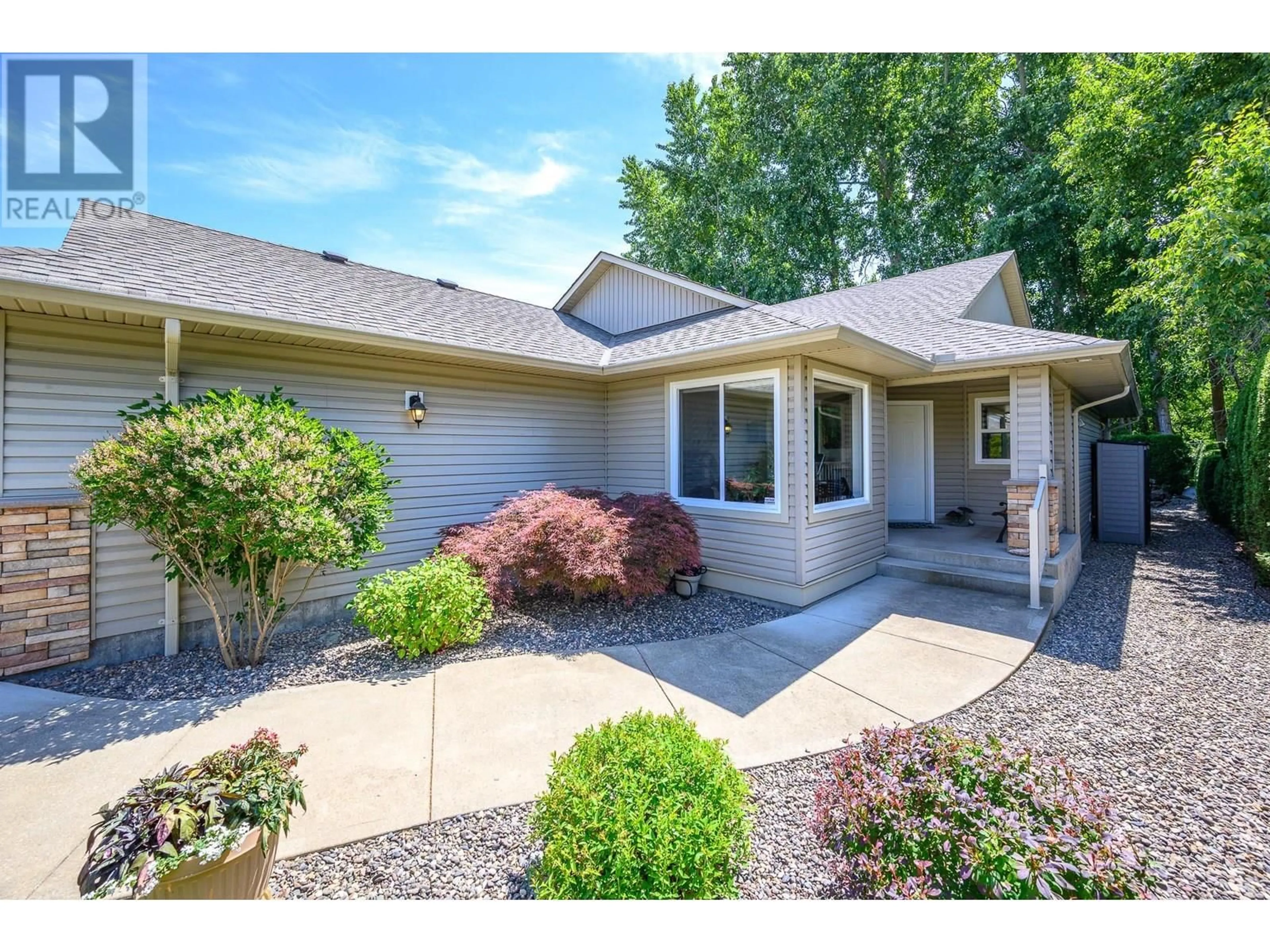 Home with vinyl exterior material, street for 106 - 2200 53 AVENUE, Vernon British Columbia V1T9N8