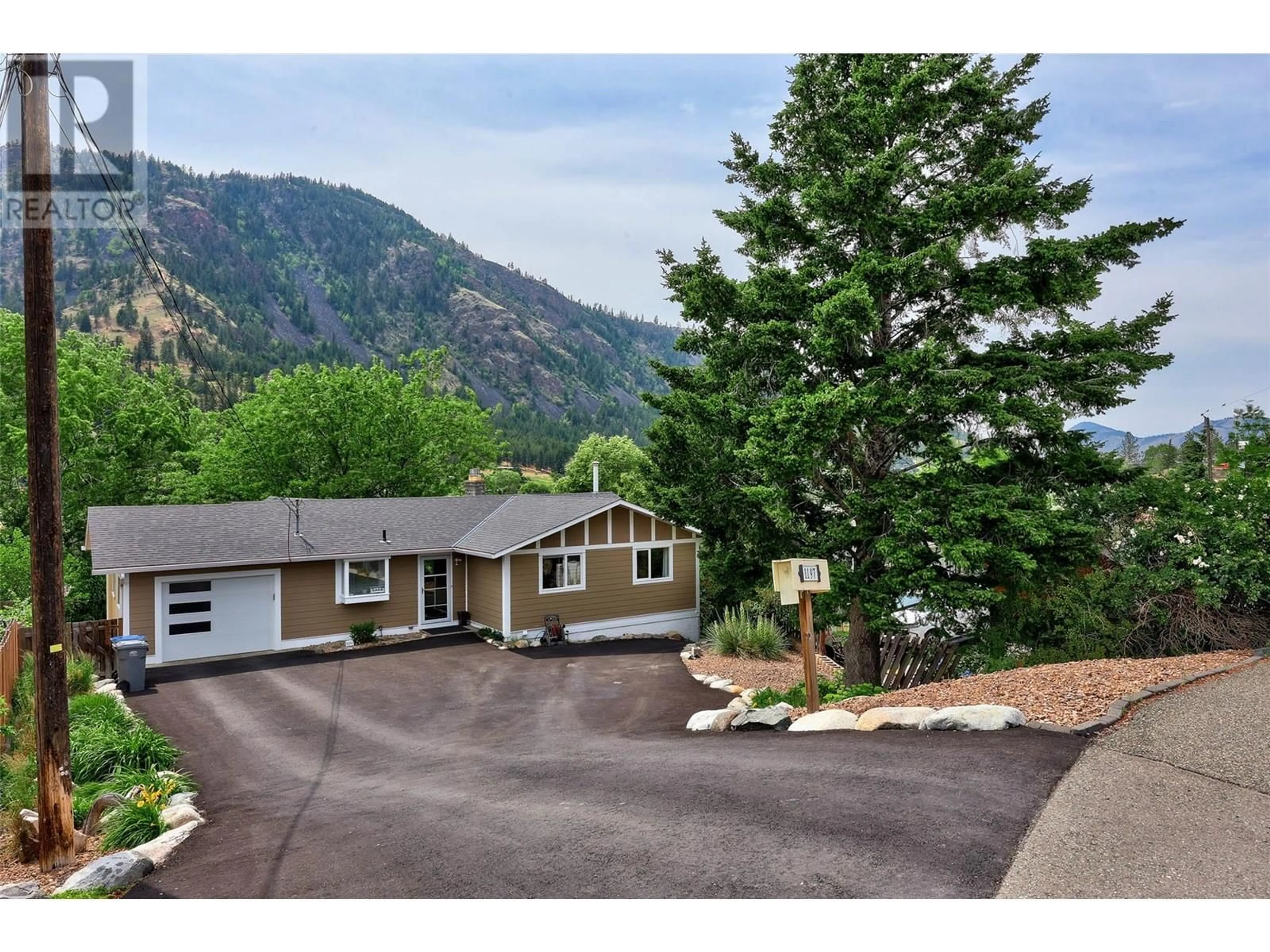 A pic from outside/outdoor area/front of a property/back of a property/a pic from drone, mountain view for 1197 HIGHRIDGE DRIVE, Kamloops British Columbia V2C5G5