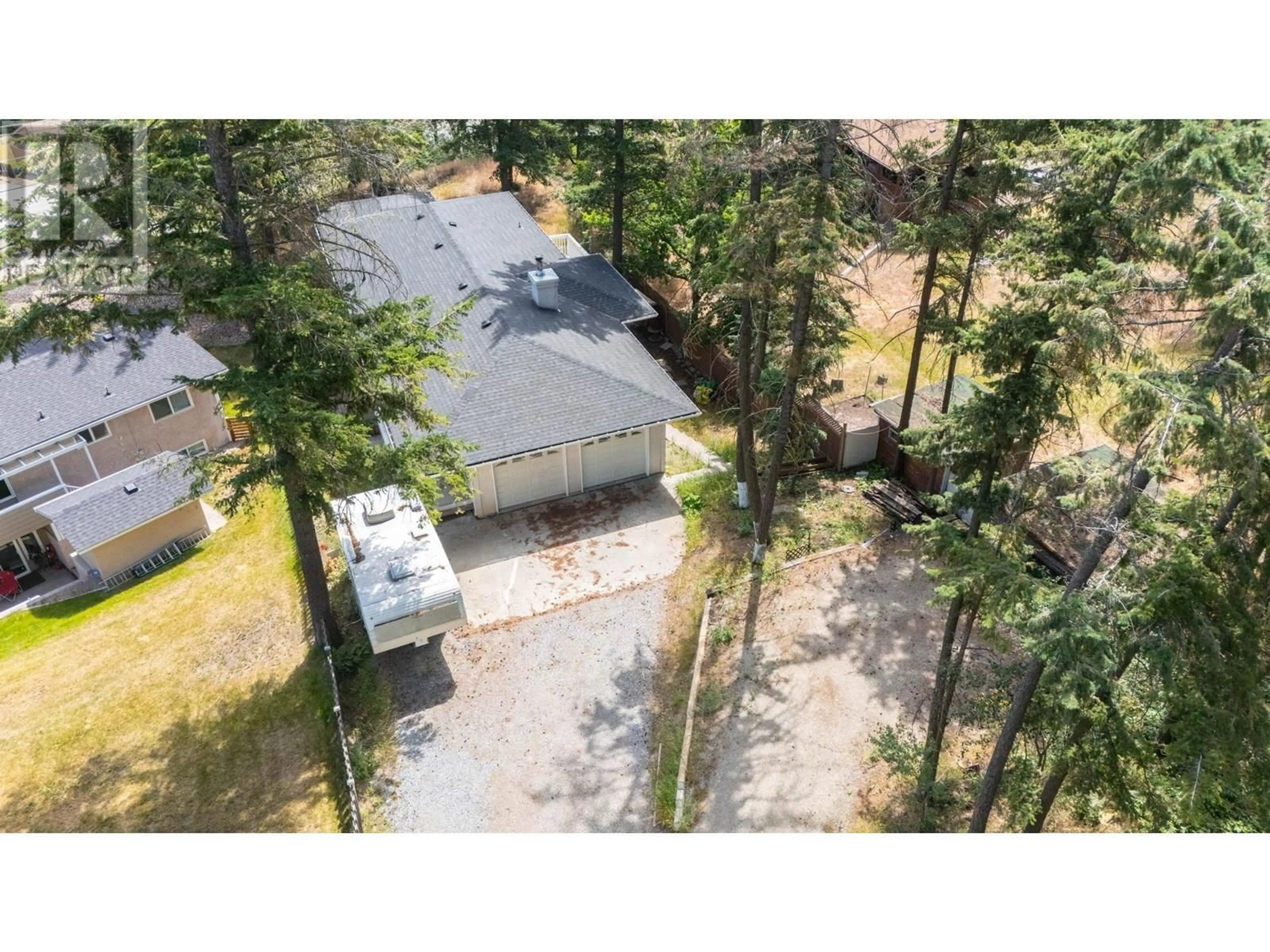 A pic from outside/outdoor area/front of a property/back of a property/a pic from drone, forest/trees view for 334 CLIFTON ROAD SOUTH, Kelowna British Columbia V1V1A5
