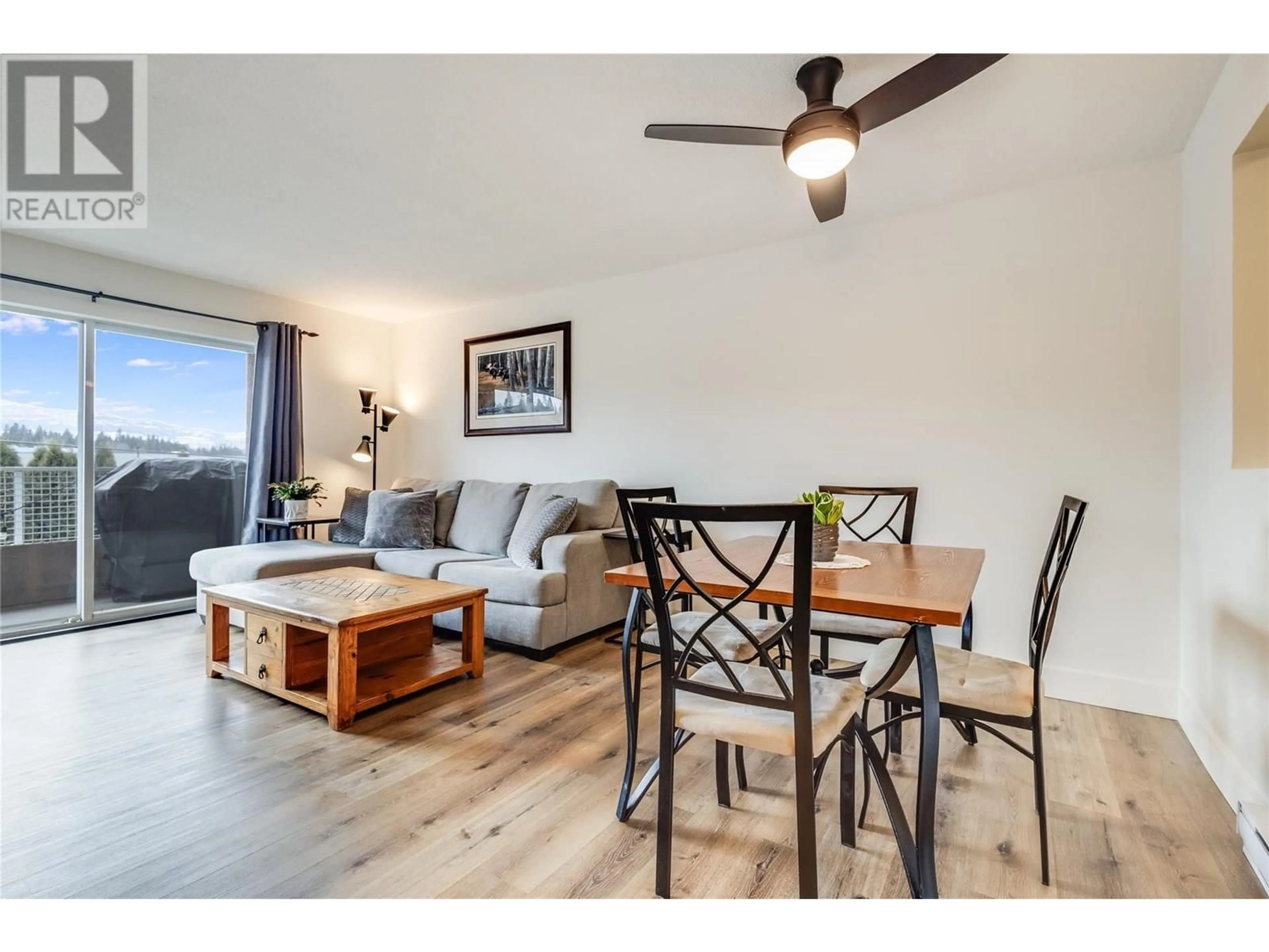 Living room with furniture, wood/laminate floor for 304 - 2035 BARON ROAD, Kelowna British Columbia V1X7G3