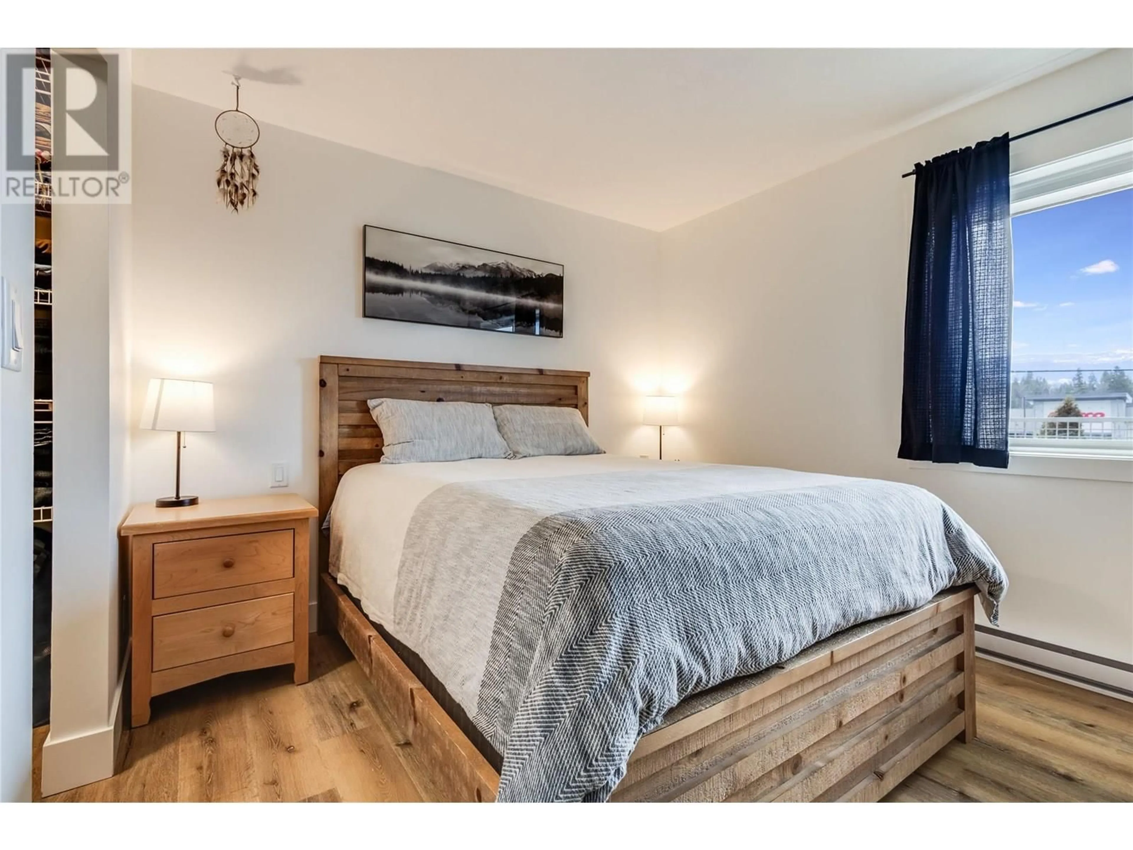 Bedroom with bed, wood/laminate floor for 304 - 2035 BARON ROAD, Kelowna British Columbia V1X7G3