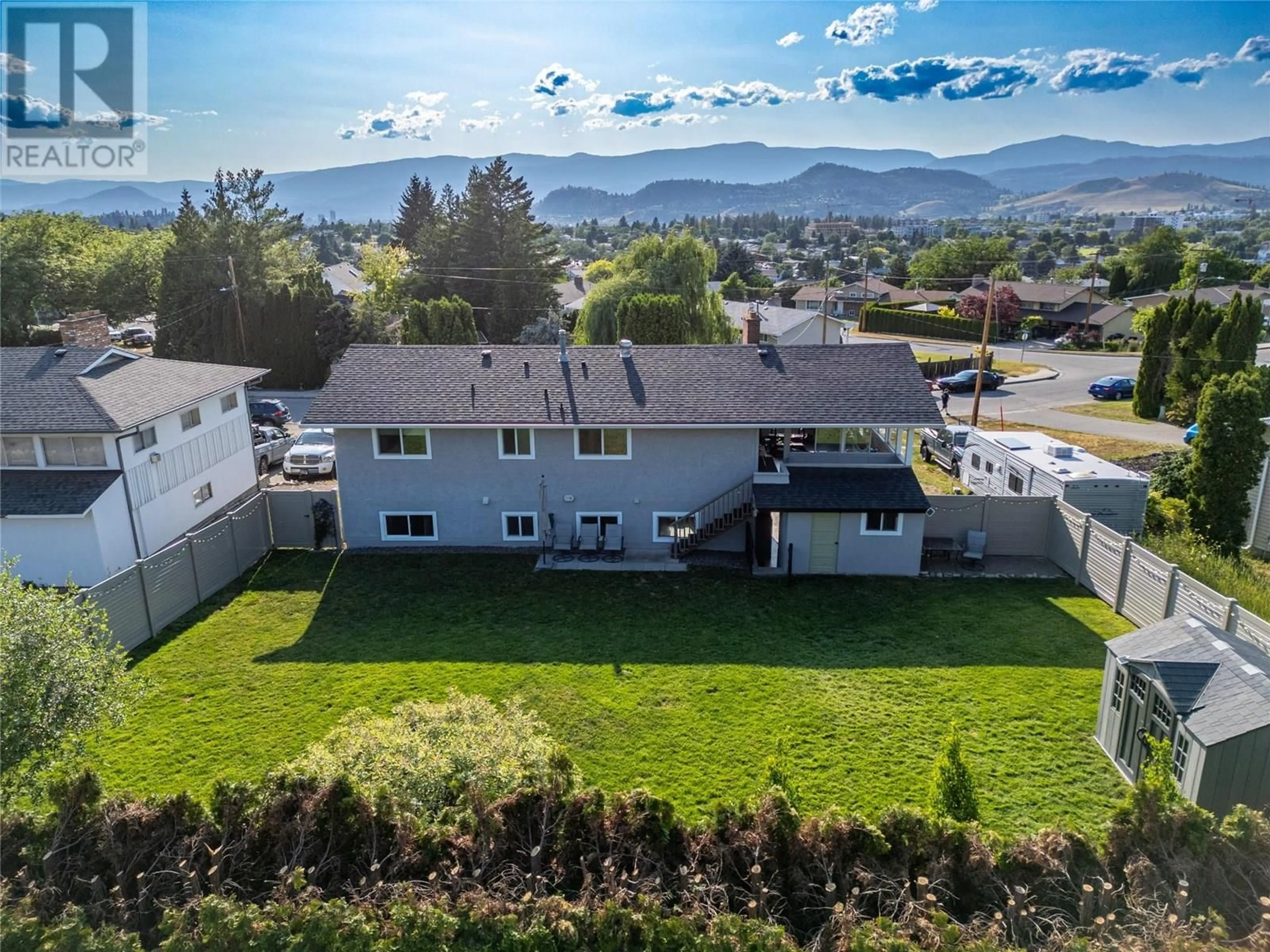 A pic from outside/outdoor area/front of a property/back of a property/a pic from drone, mountain view for 565 EASTBOURNE ROAD, Kelowna British Columbia V1X5K7