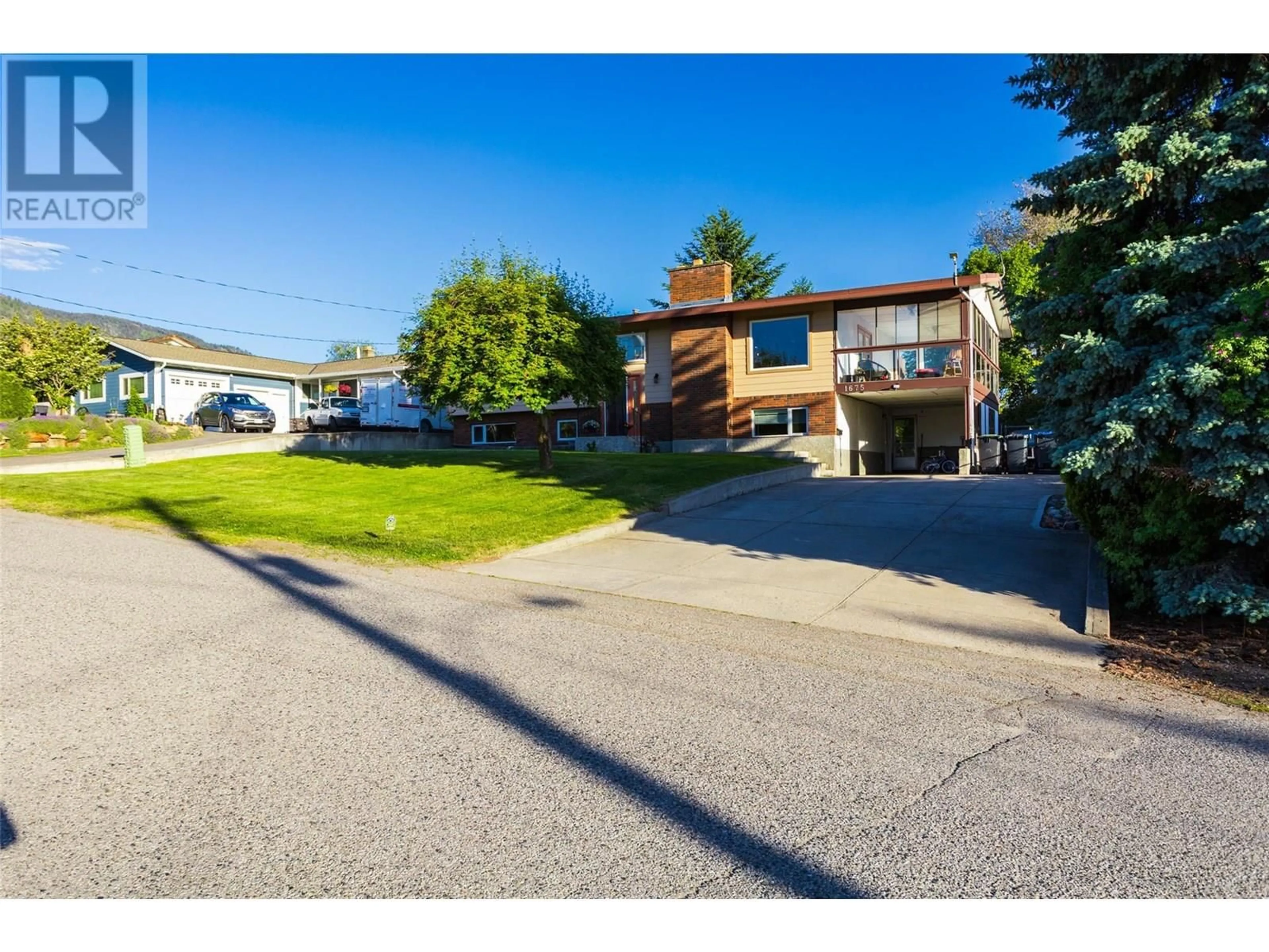 A pic from outside/outdoor area/front of a property/back of a property/a pic from drone, street for 1675 STAYMAN ROAD, Kelowna British Columbia V1P1B2