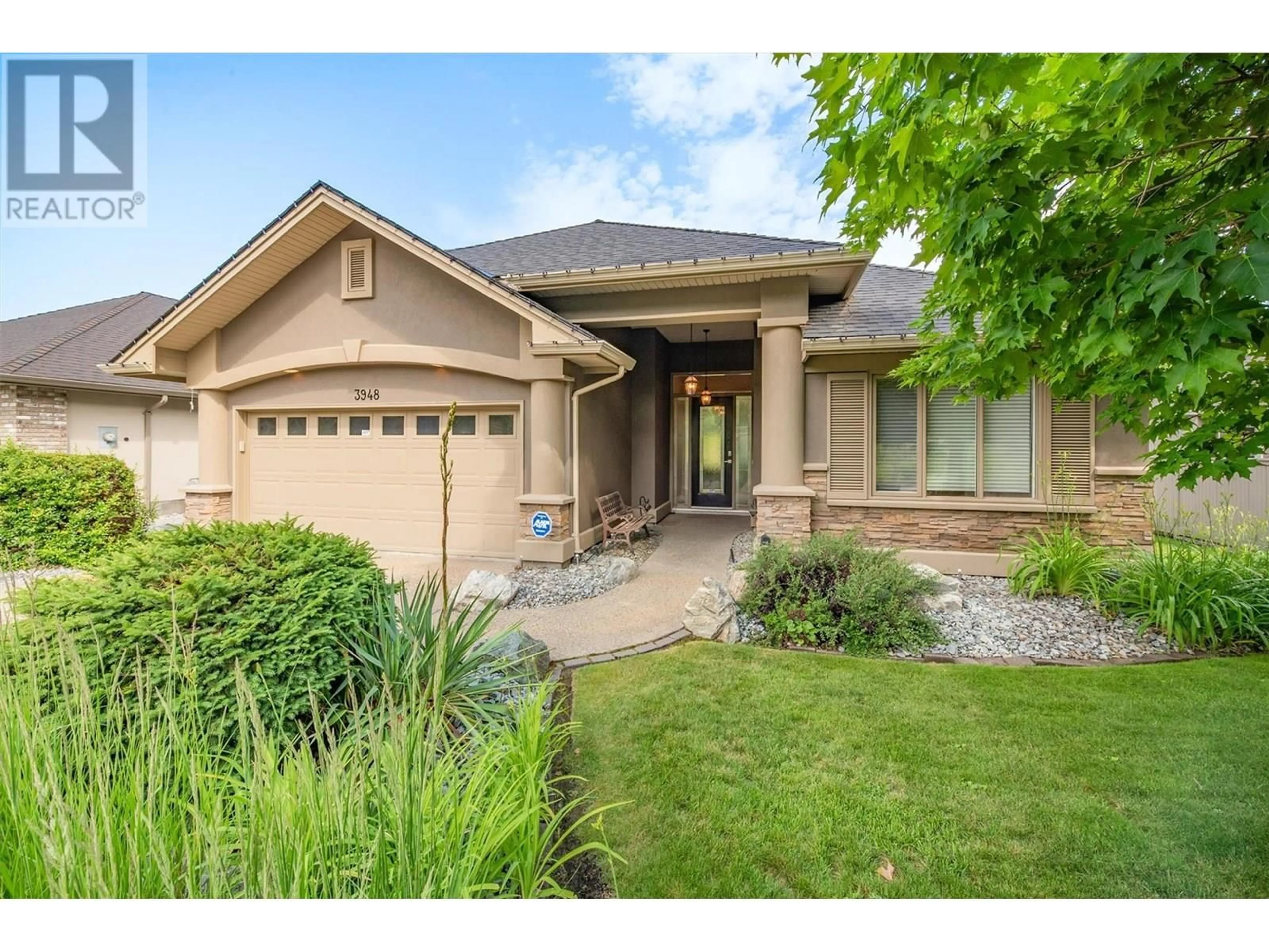 Home with brick exterior material, street for 3948 GALLAGHERS PARKWAY, Kelowna British Columbia V1W3Z9