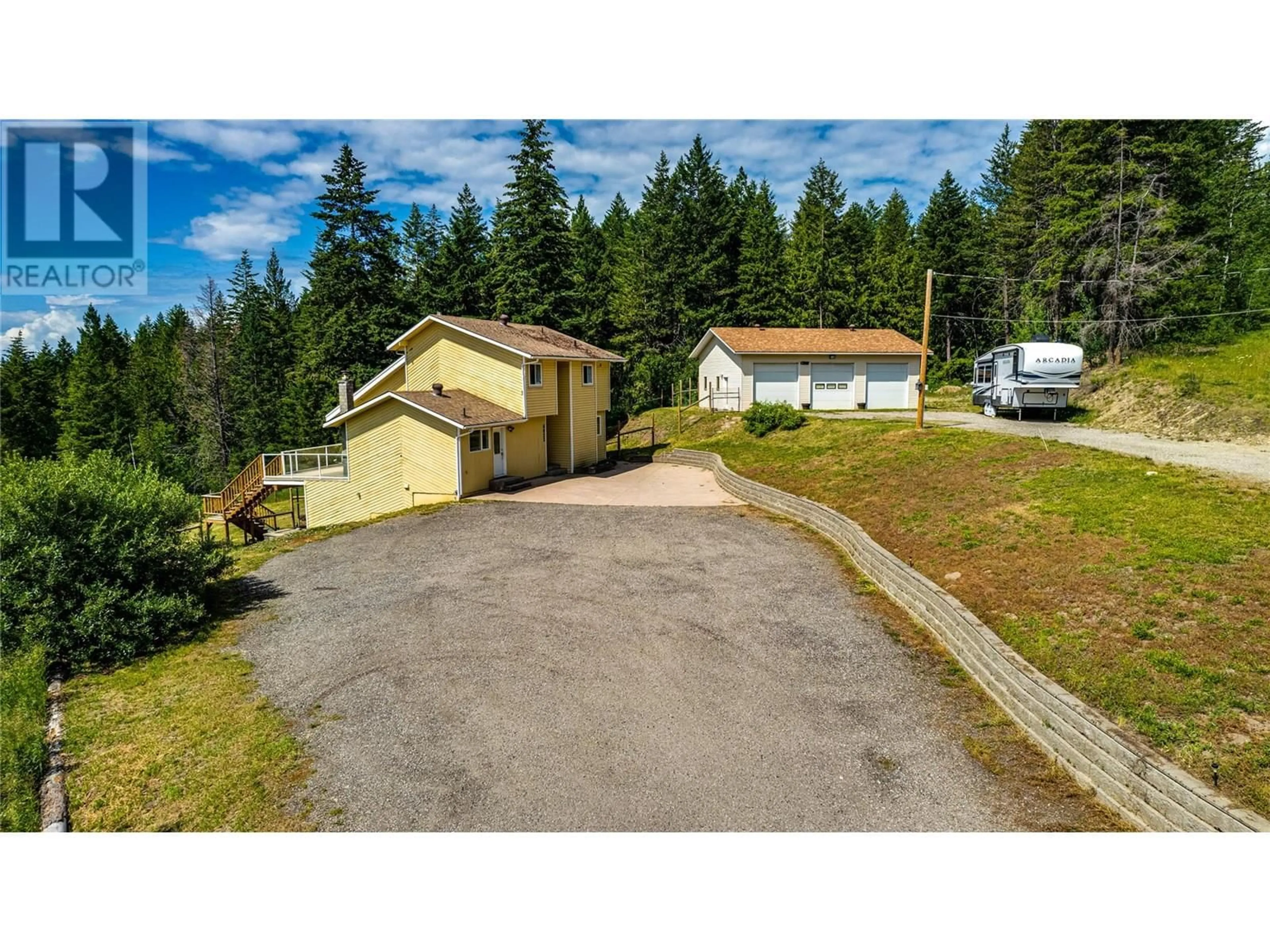 A pic from outside/outdoor area/front of a property/back of a property/a pic from drone, street for 8022 ASPEN ROAD, Vernon British Columbia V1B3M9