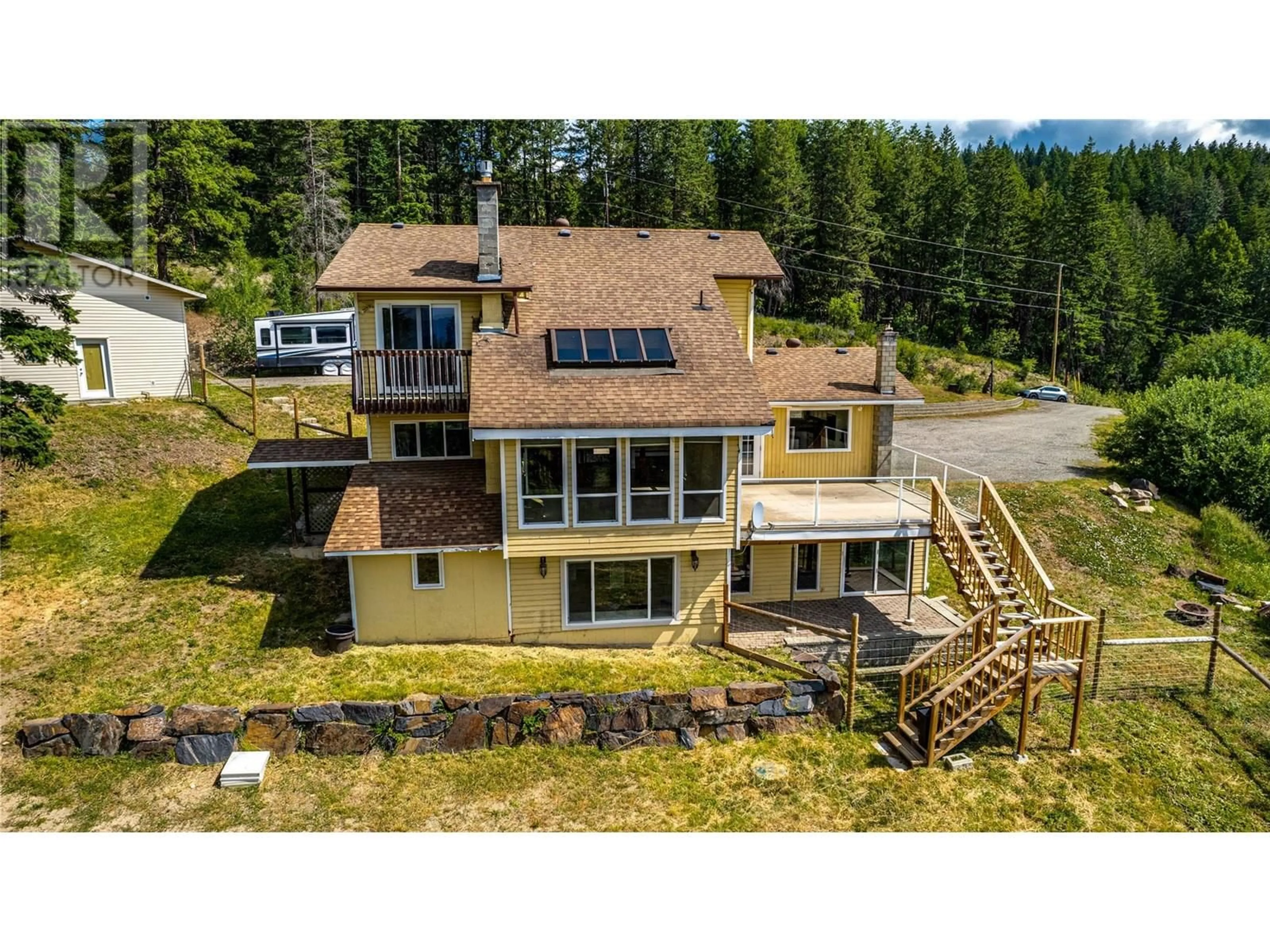 A pic from outside/outdoor area/front of a property/back of a property/a pic from drone, water/lake/river/ocean view for 8022 ASPEN ROAD, Vernon British Columbia V1B3M9