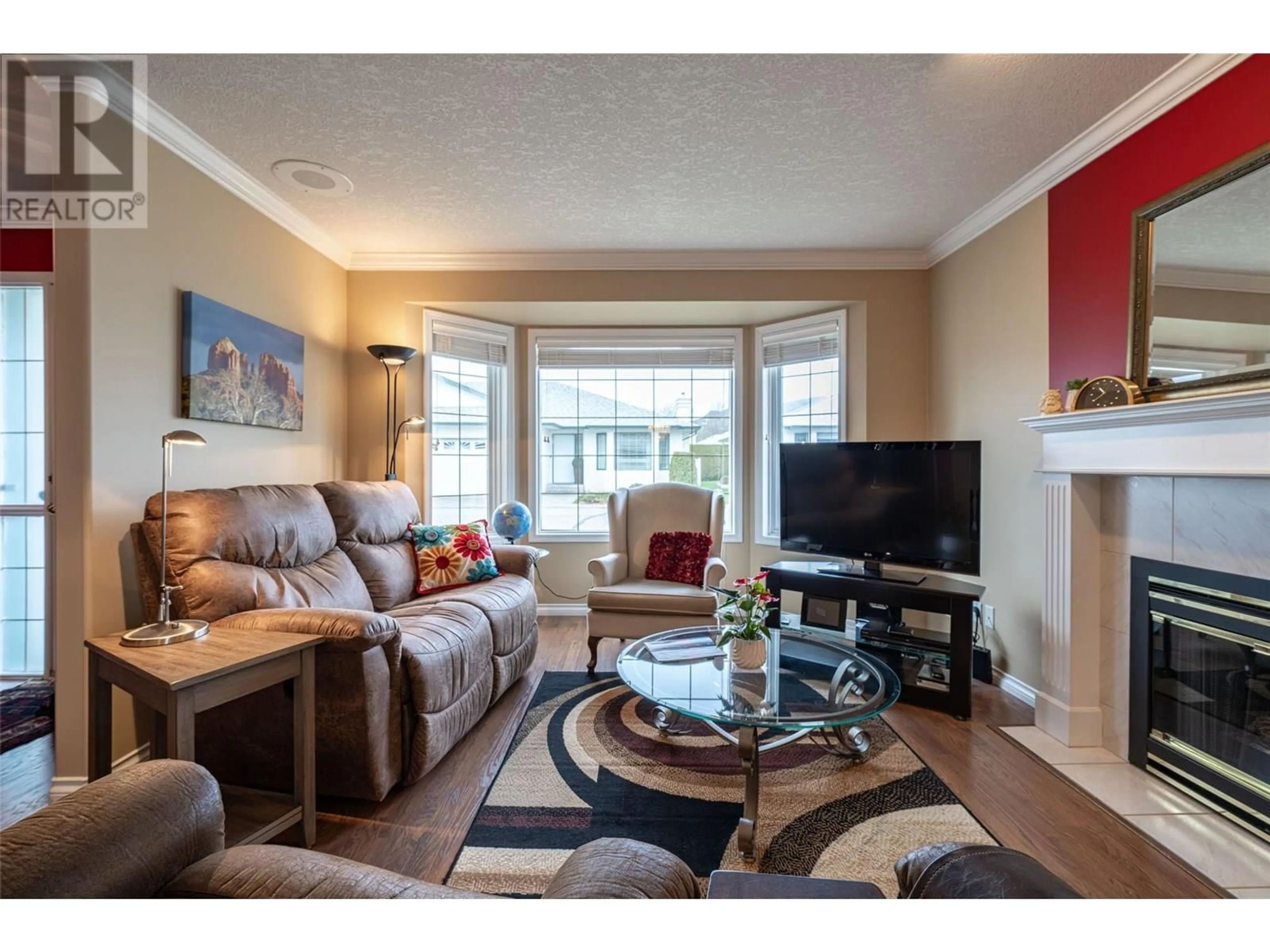 Living room with furniture, wood/laminate floor for 71 - 2710 ALLENBY WAY, Vernon British Columbia V1T9P2