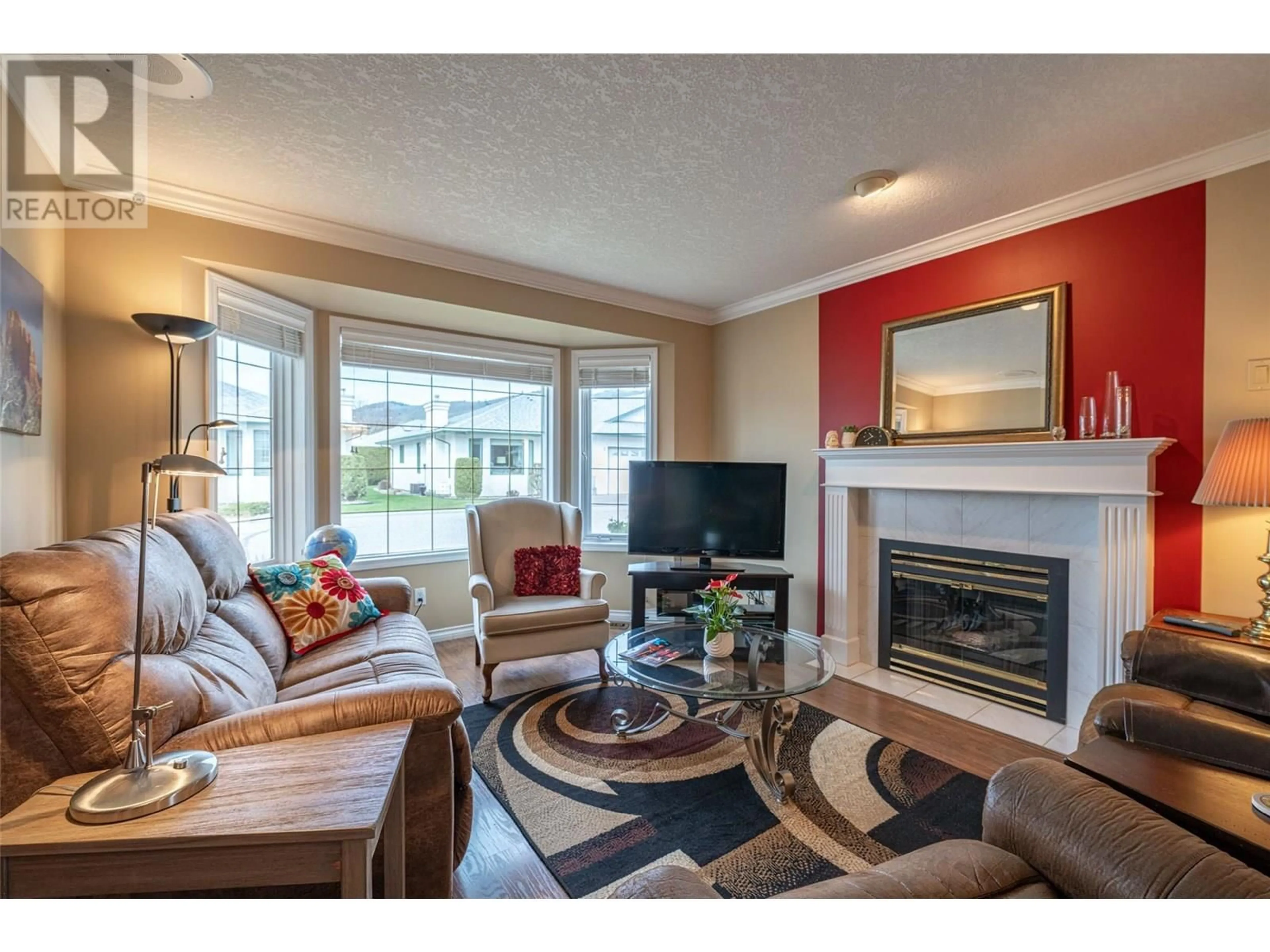 Living room with furniture, wood/laminate floor for 71 - 2710 ALLENBY WAY, Vernon British Columbia V1T9P2