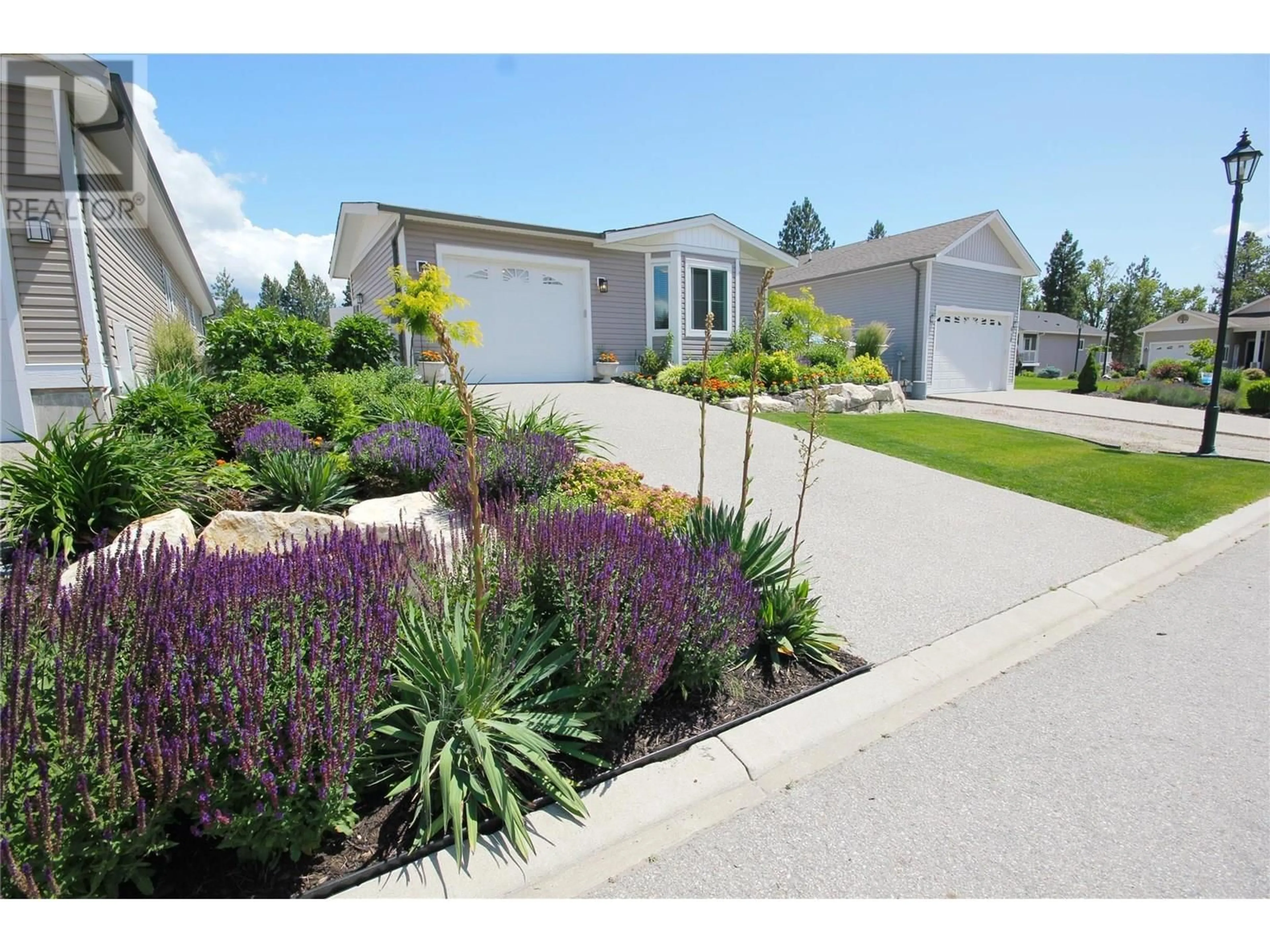 Home with vinyl exterior material, street for G11 - 4505 MCLEAN CREEK ROAD, Okanagan Falls British Columbia V0H1R1