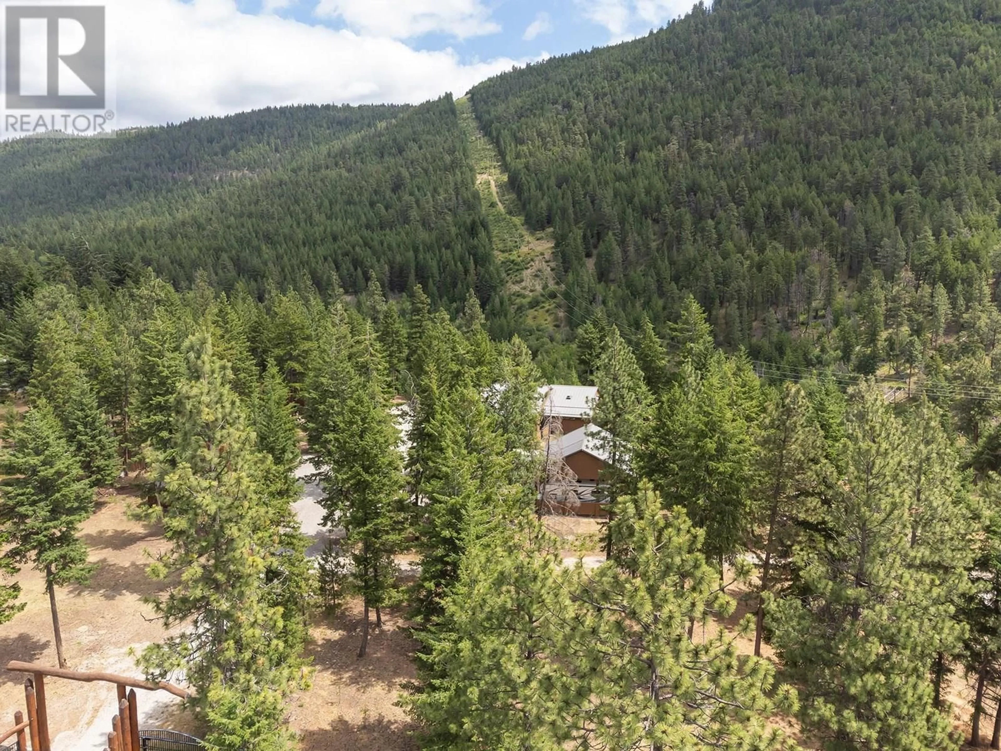 A pic from outside/outdoor area/front of a property/back of a property/a pic from drone, forest/trees view for 4335 MAXWELL ROAD, Peachland British Columbia V0H1X3