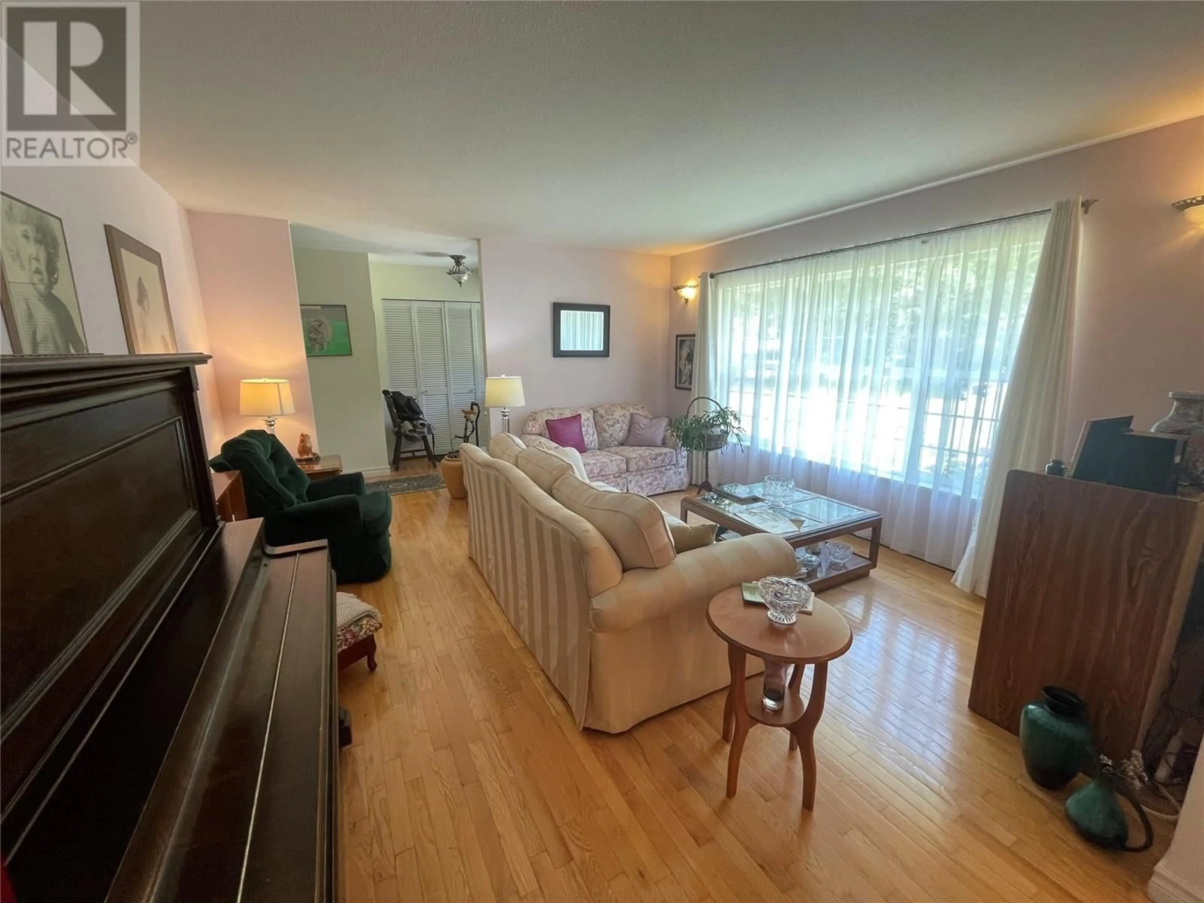 Living room with furniture, wood/laminate floor for 3915 EXPRESS POINT ROAD, Scotch Creek British Columbia V0E1M5