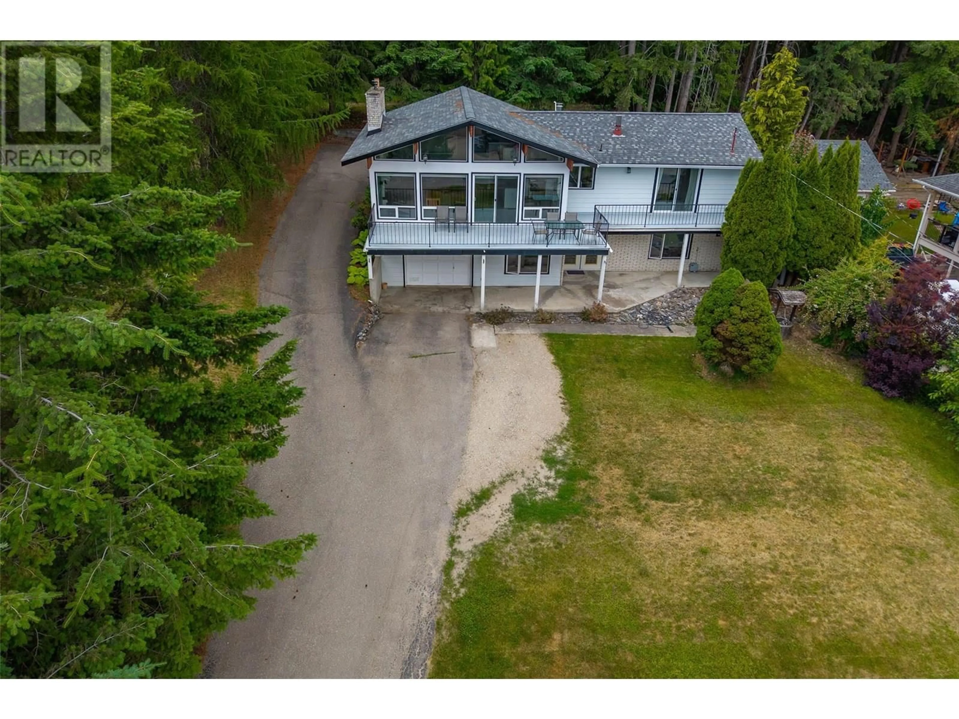 A pic from outside/outdoor area/front of a property/back of a property/a pic from drone, water/lake/river/ocean view for 2250 LAKEVIEW DRIVE, Blind Bay British Columbia V0E2W2