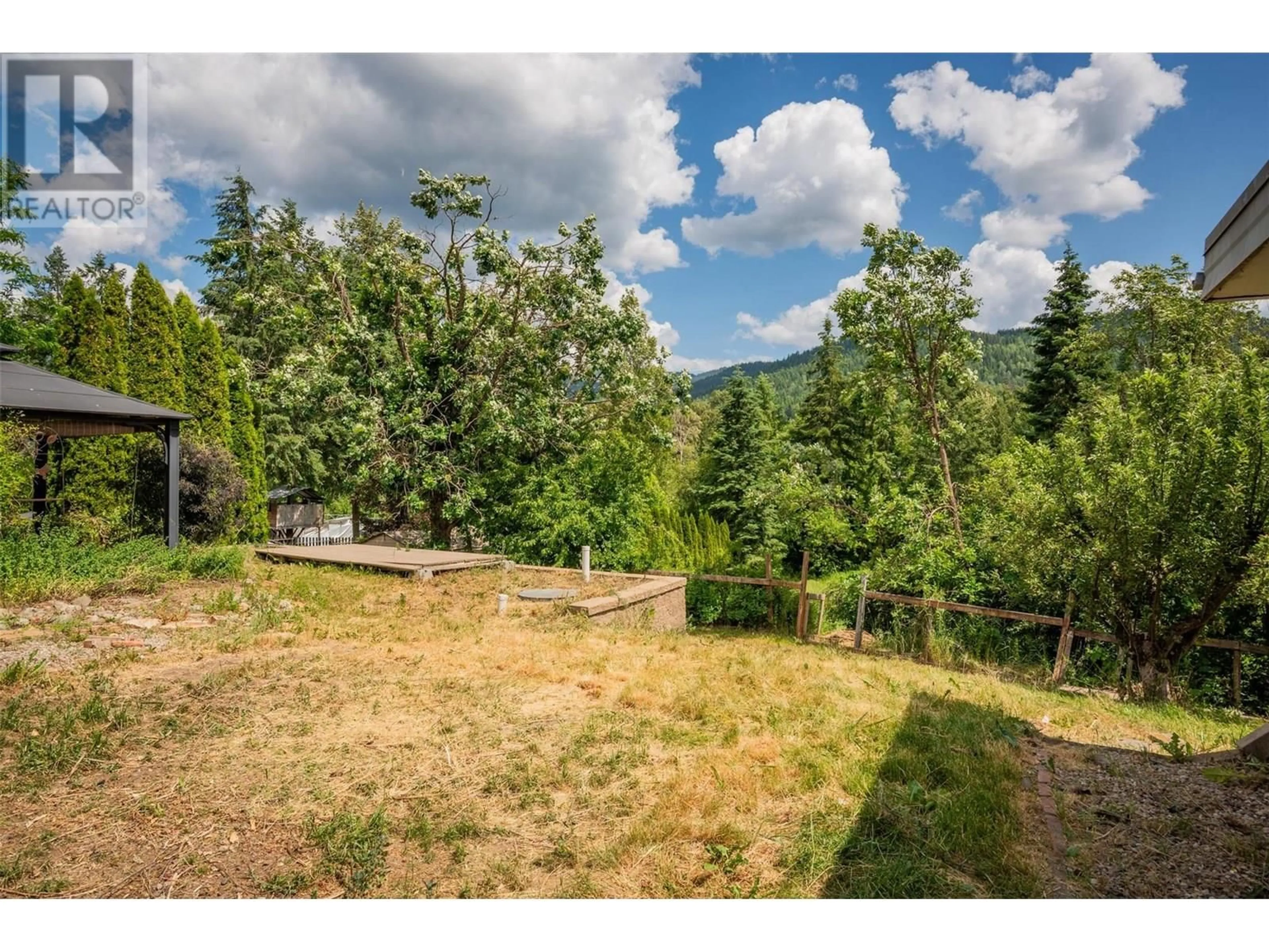 A pic from outside/outdoor area/front of a property/back of a property/a pic from drone, forest/trees view for 1500 3B HWY OTHER, Fruitvale British Columbia V0G1L1