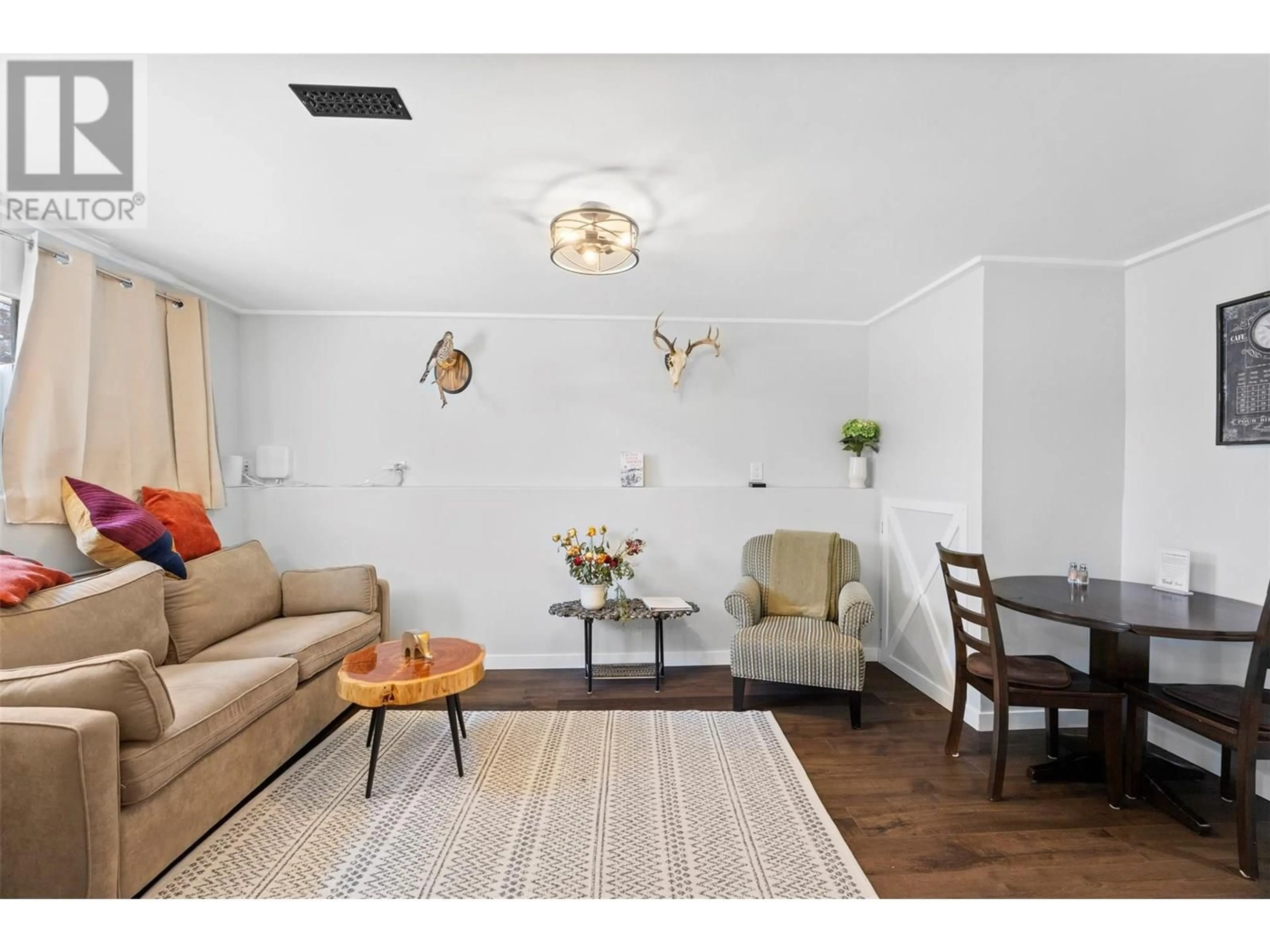 Living room with furniture, wood/laminate floor for 316 LINDEN AVENUE, Kamloops British Columbia V2B2M9