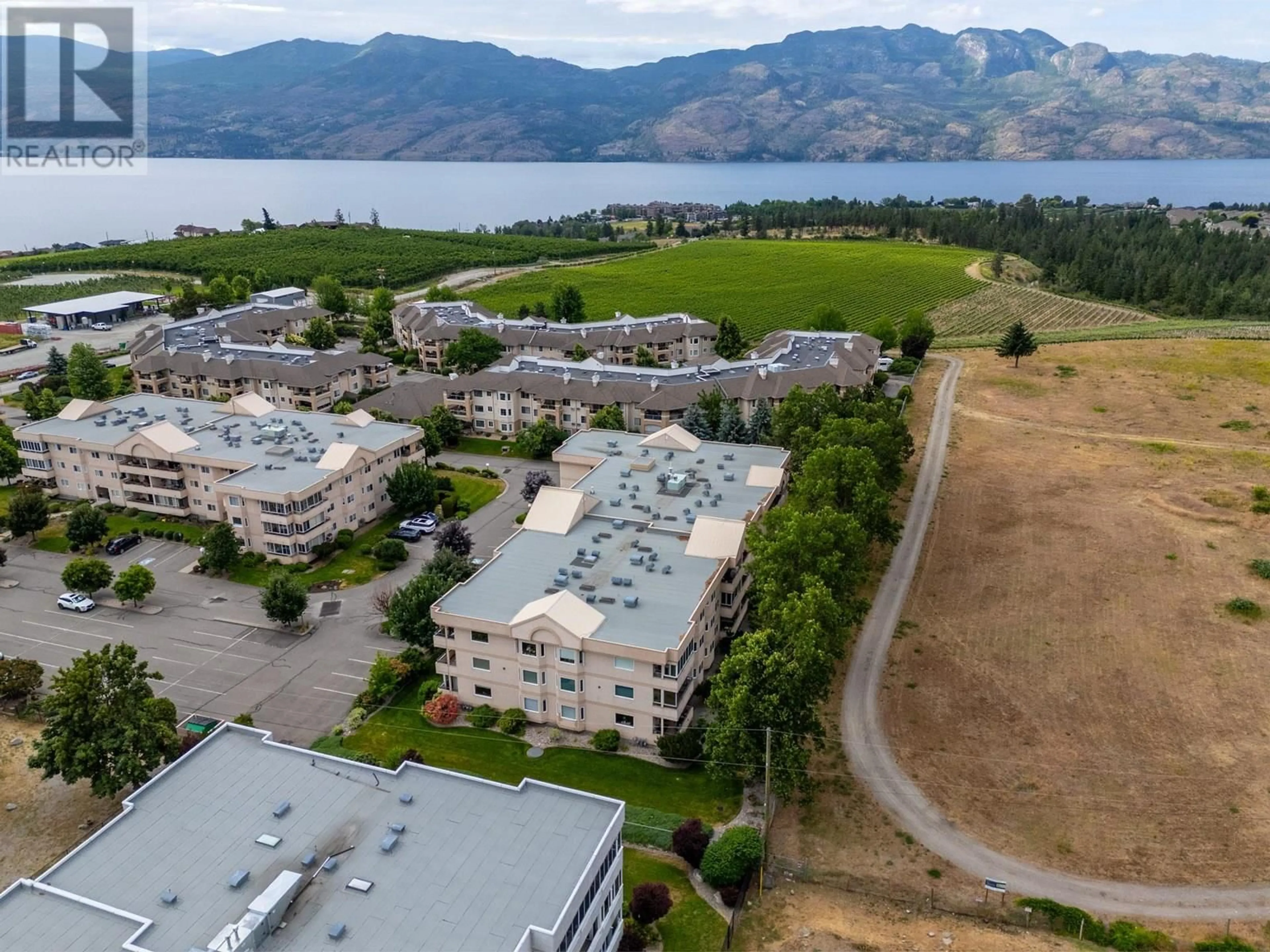 A pic from outside/outdoor area/front of a property/back of a property/a pic from drone, mountain view for 205 - 3858 BROWN ROAD, West Kelowna British Columbia V4T2J5
