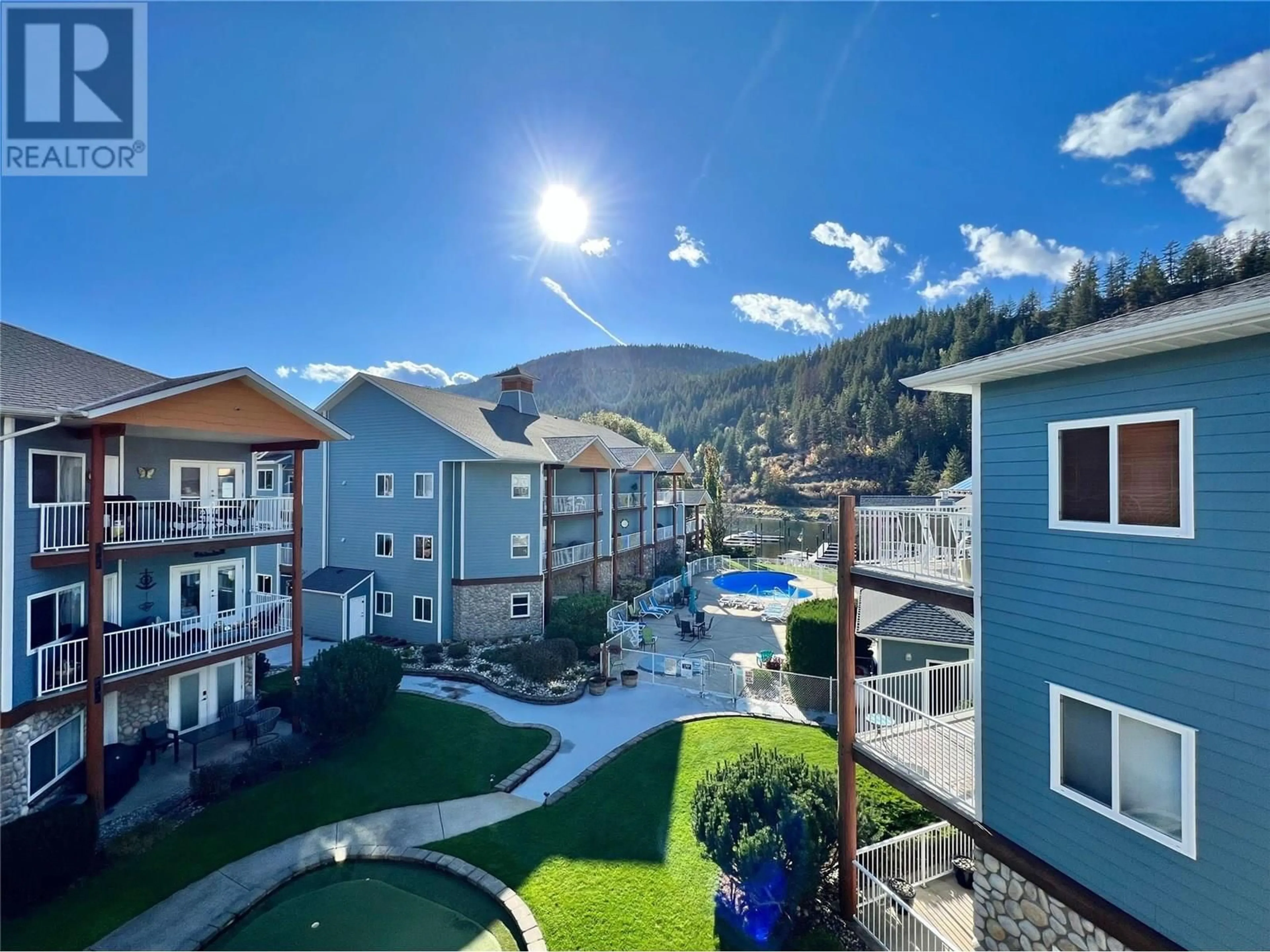A pic from outside/outdoor area/front of a property/back of a property/a pic from drone, mountain view for B304 - 1118 RIVERSIDE AVENUE, Sicamous British Columbia V0E2V1