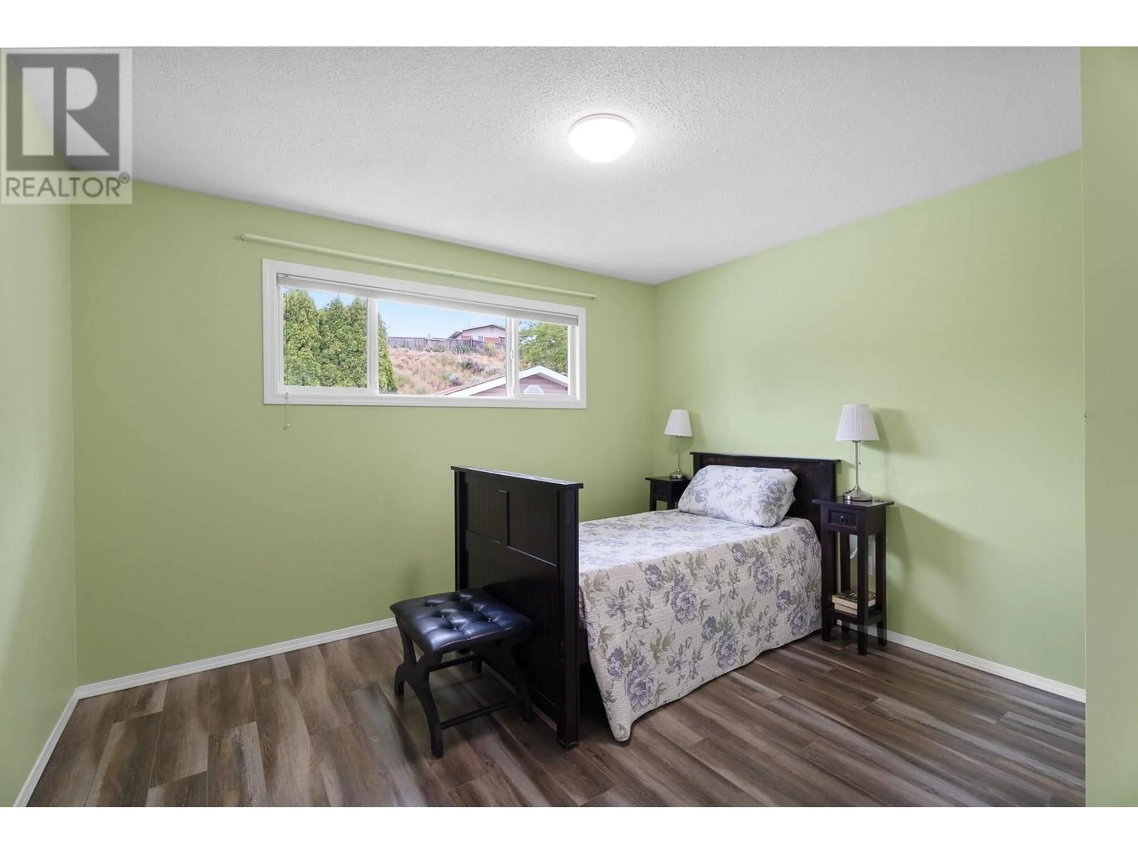 Bedroom with bed, wood/laminate floor for 2819 CRANNA CRESCENT, Merritt British Columbia V1K1E6