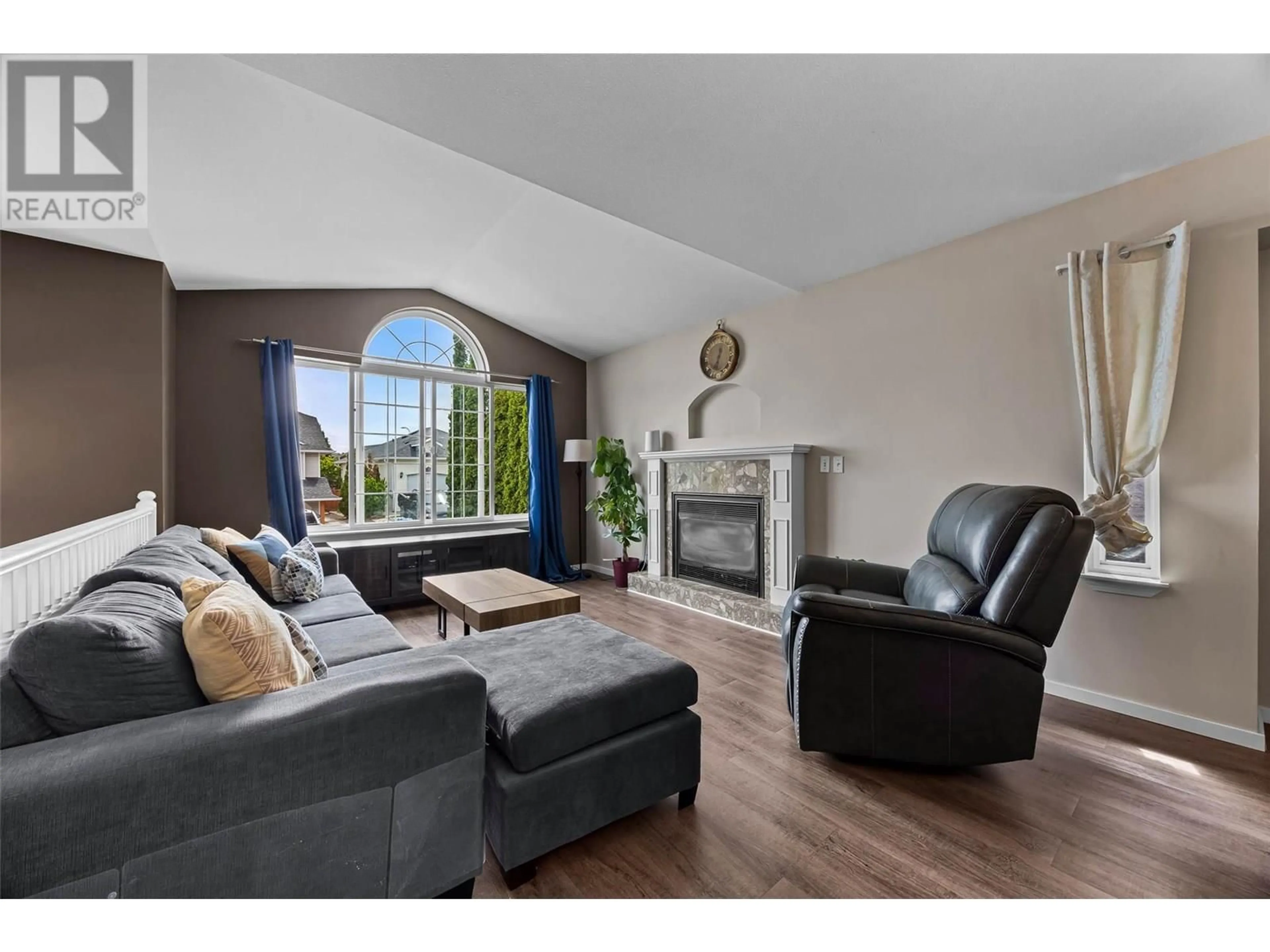 Living room with furniture, wood/laminate floor for 2217 TURNBERRY PLACE, Kamloops British Columbia V1S1S7