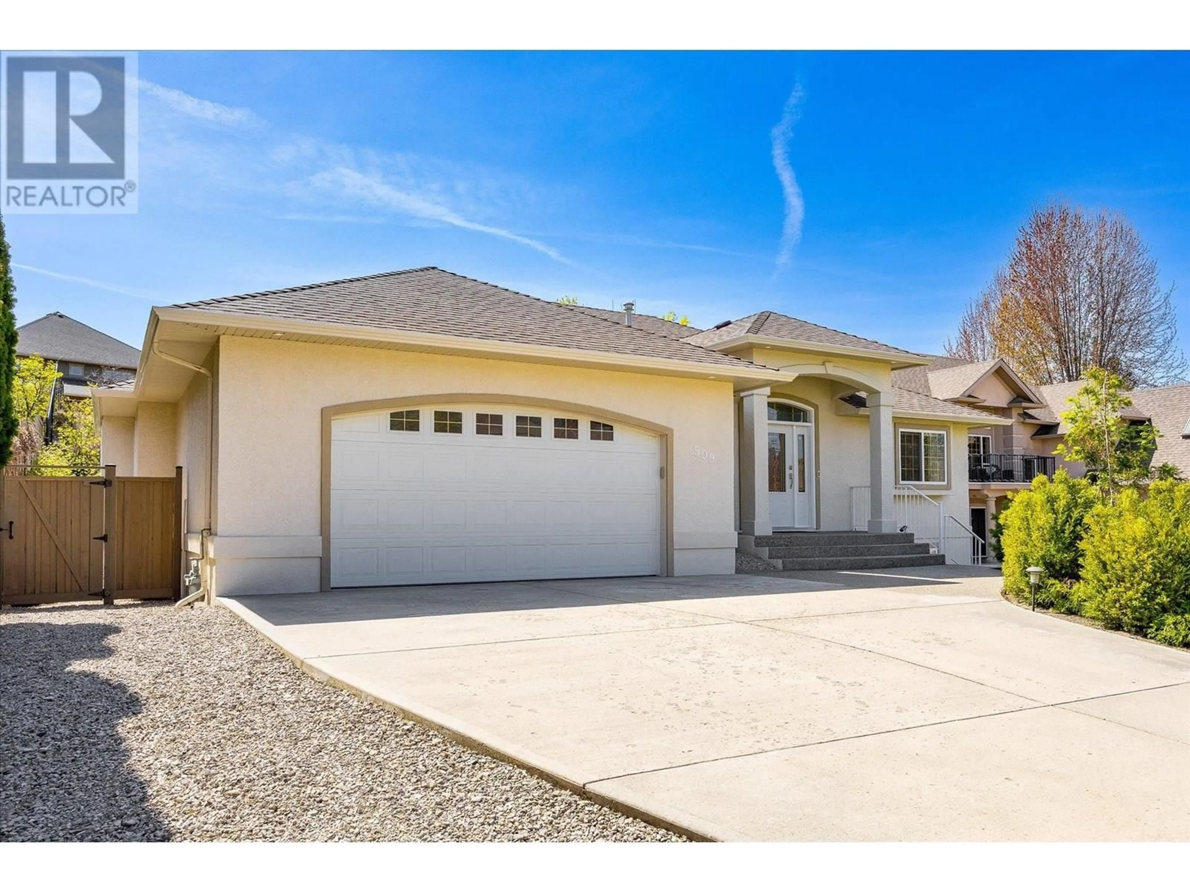 Home with vinyl exterior material, street for 509 CURLEW DRIVE, Kelowna British Columbia V1W4K9