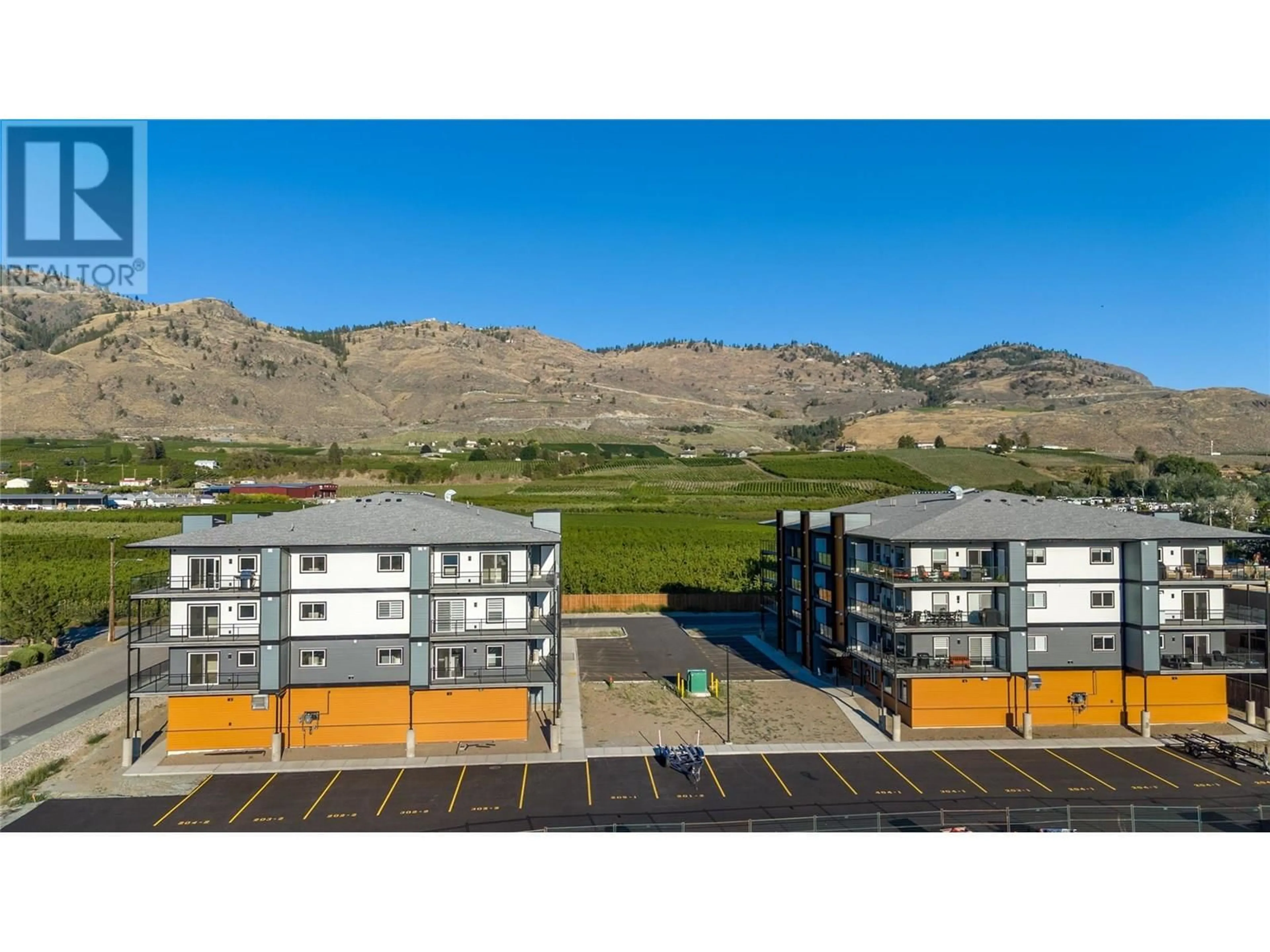 A pic from outside/outdoor area/front of a property/back of a property/a pic from drone, mountain view for 307 - 5620 51ST STREET, Osoyoos British Columbia V0H1V6