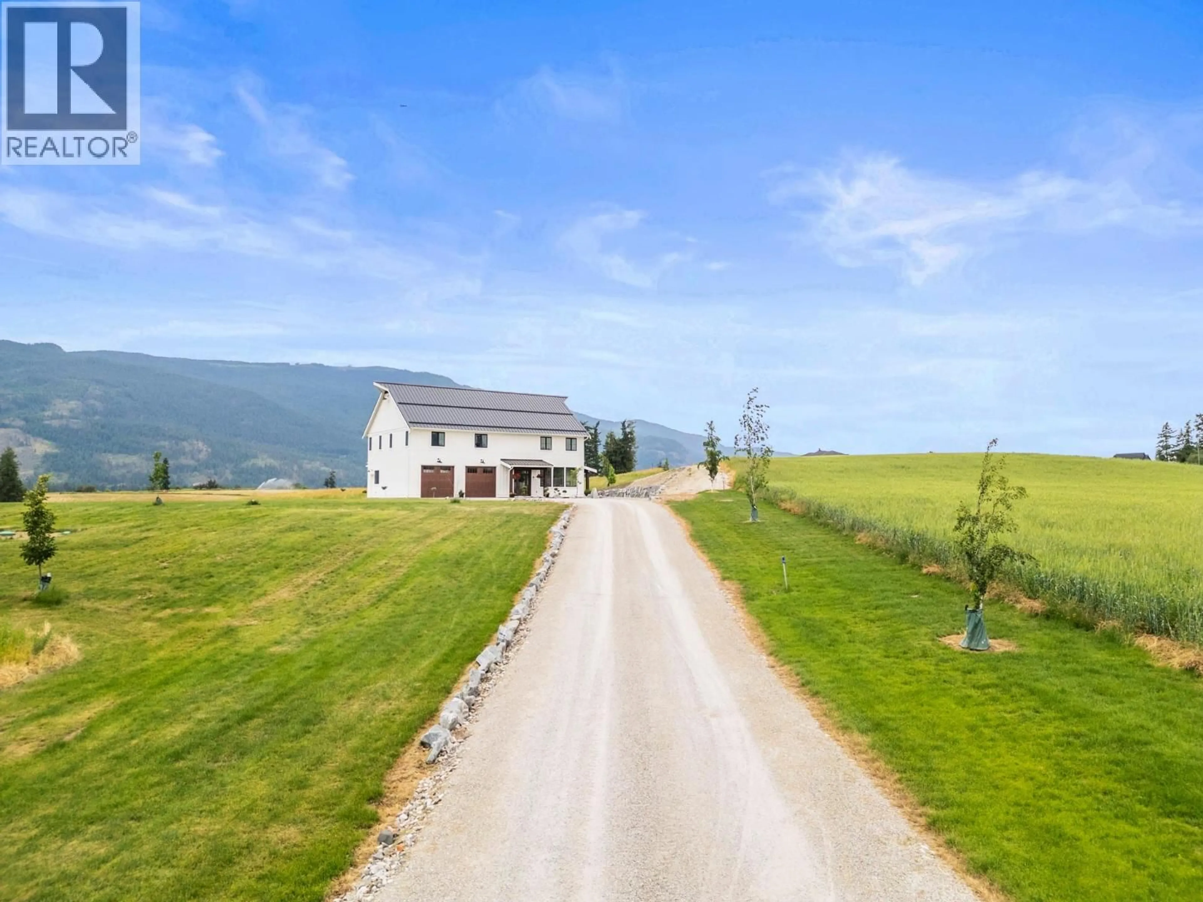 A pic from outside/outdoor area/front of a property/back of a property/a pic from drone, mountain view for 2589 YOUNG ROAD, Spallumcheen British Columbia V4Y0L3