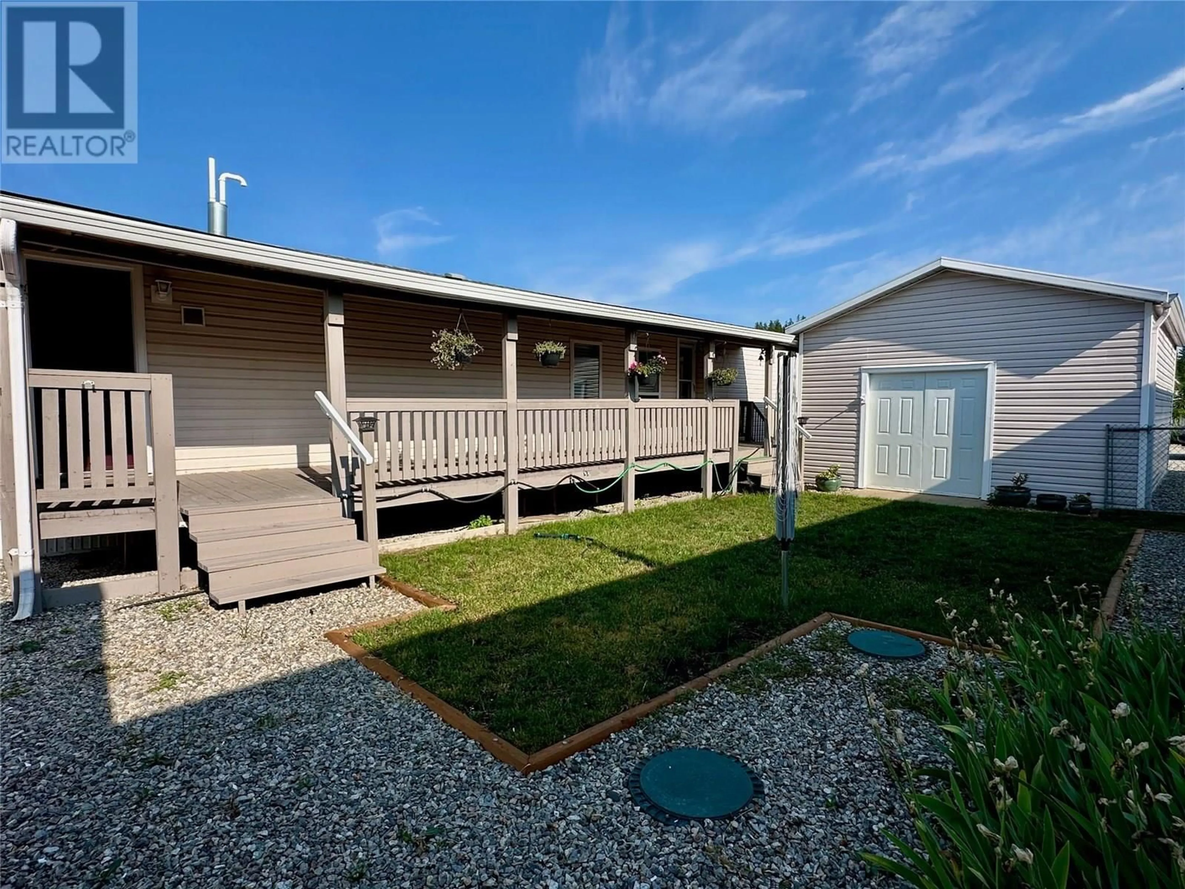 A pic from outside/outdoor area/front of a property/back of a property/a pic from drone, street for 27 - 12560 WESTSIDE ROAD, Vernon British Columbia V1H1S9