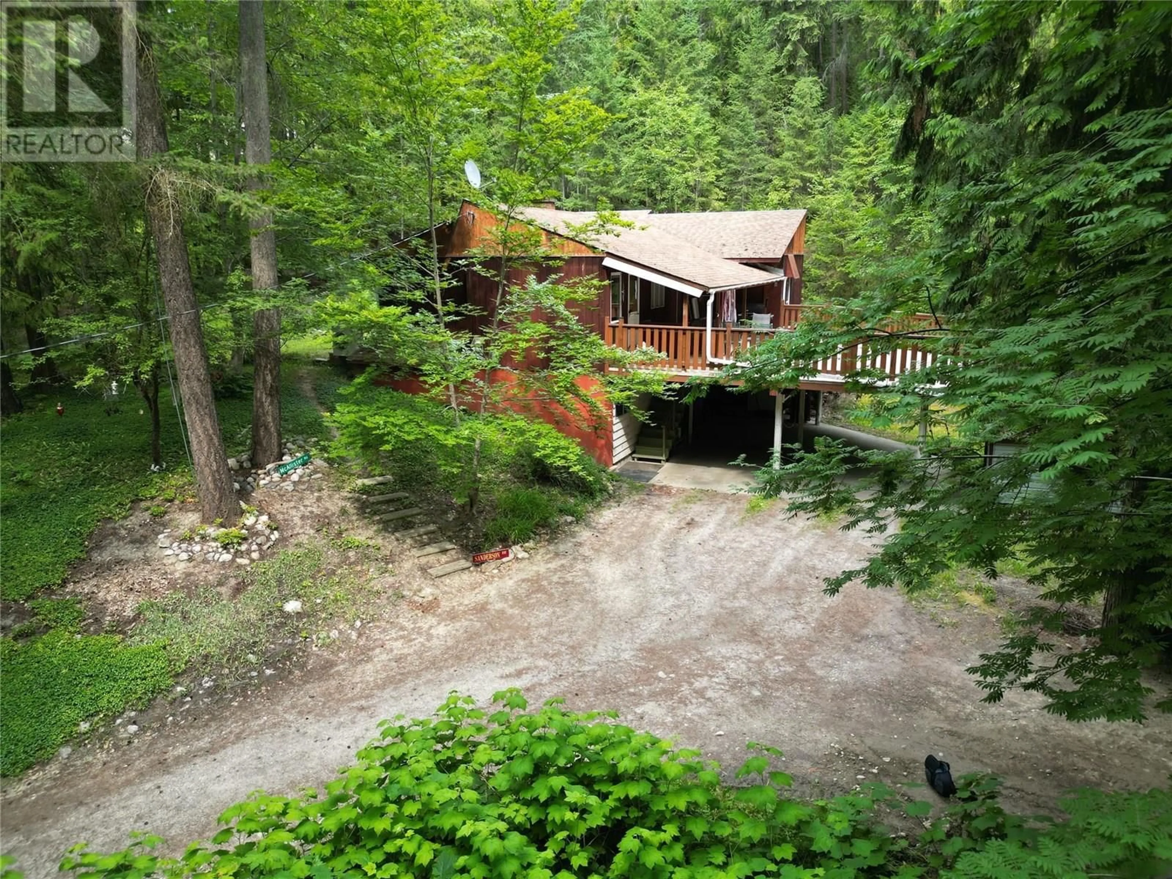 A pic from outside/outdoor area/front of a property/back of a property/a pic from drone, forest/trees view for 8043 97A HIGHWAY, Mara British Columbia V0E2K0